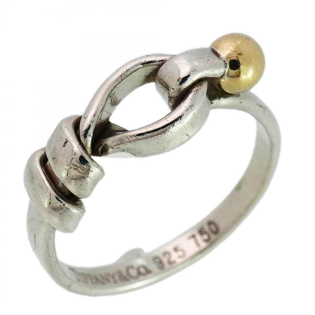 Tiffany & Co. Hook Eye Ring, 18K Yellow Gold (KYG), Sterling Silver (925), Size 12.5, Women's: --- Catalog ---Category: SizeJP Size: 12.5US Size: 6.5Category: DesignType: Band ringGender: WomenMaterial: Silver 925, Yellow gold (18K)Category: GeneralBrand: Tiffany--- Item List ---Section: Condit