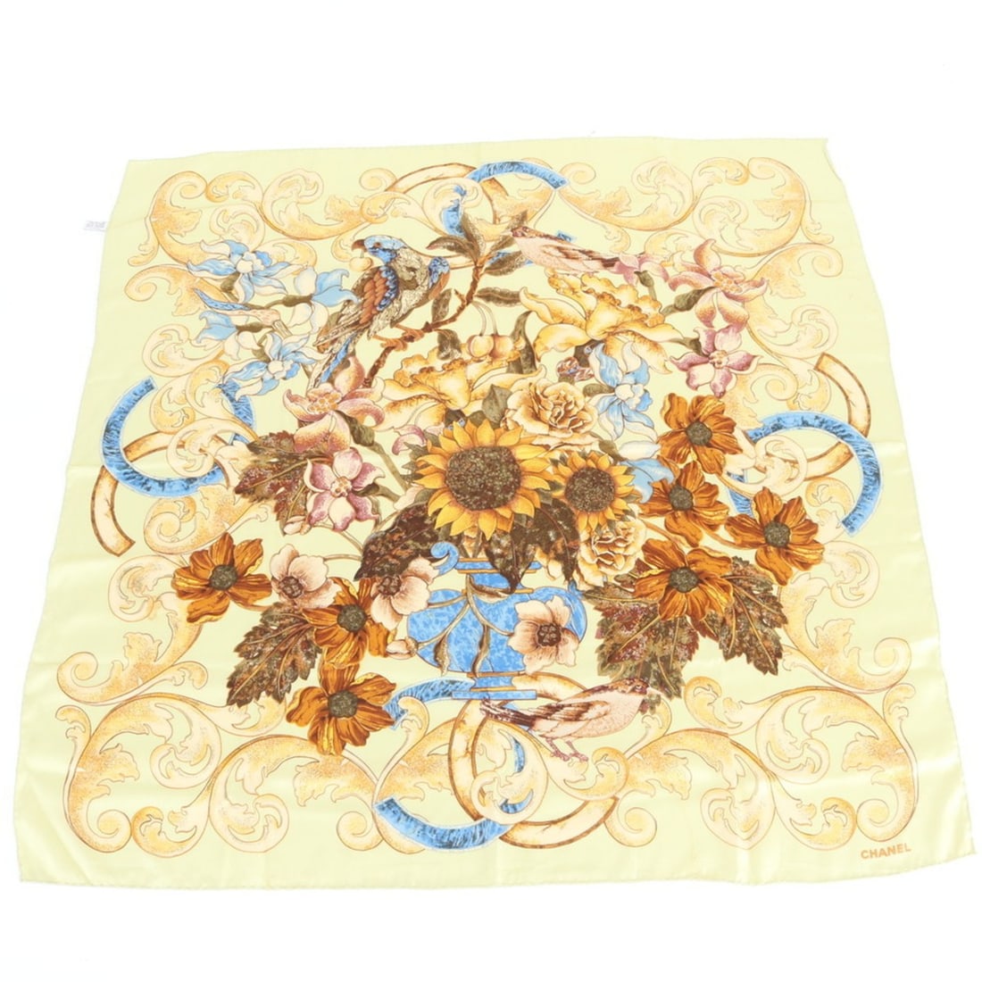 Chanel Silk Flower Sunflower Bird Scarf/Muffler for Women: --- Catalog ---Category: SizeSize (LxW): 95cm x 94cm / 37.4'' x 37''Category: DesignType: ScarfColor: YellowGender: WomenMaterial: Silk Category: GeneralBrand: ChanelCountry of Origin: Italy--- Item L