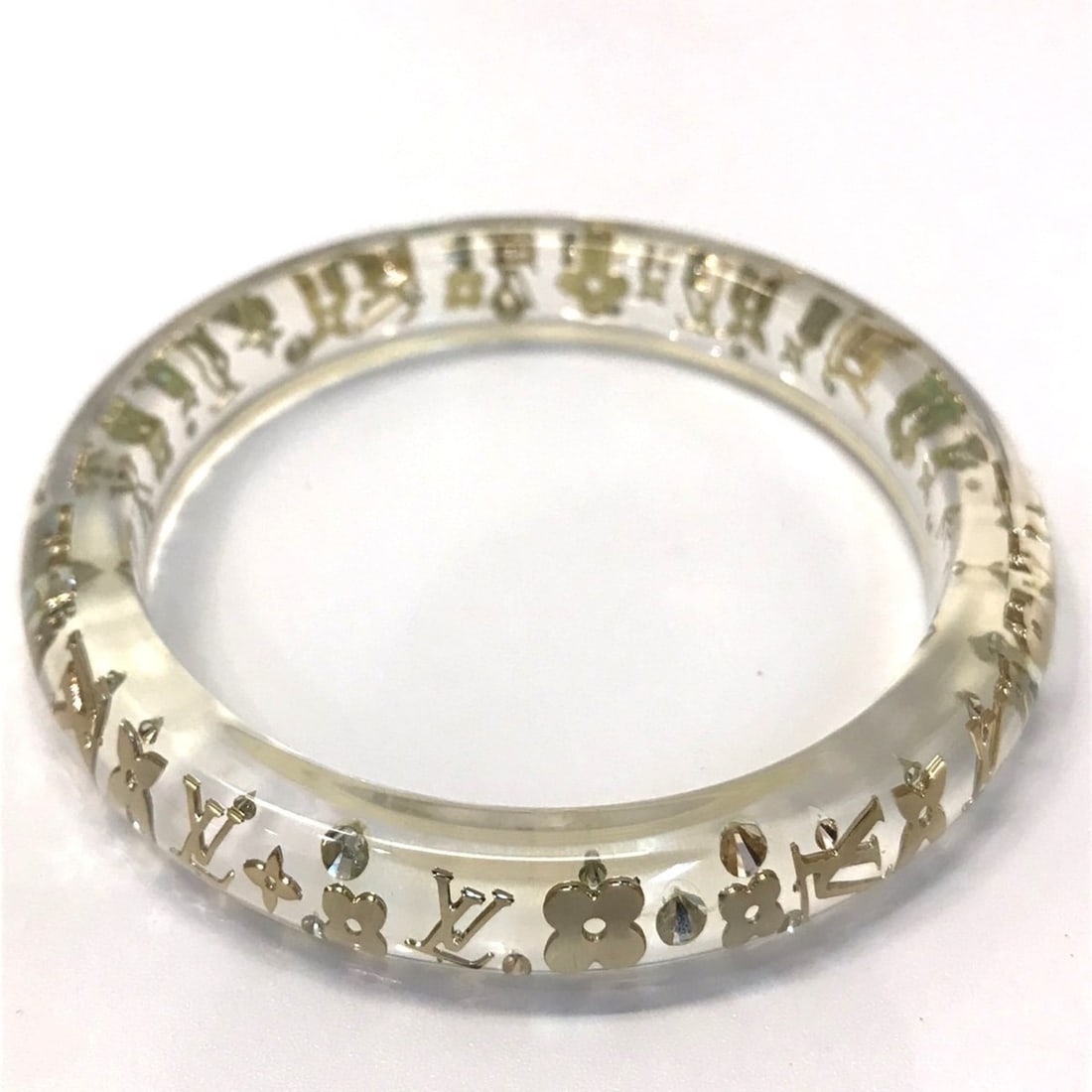 Louis Vuitton Brassle Inclusion Clear Color Bracelet Bangle Women's M65867 LOUIS VUITTON: --- Catalog ---Category: SizeLength: 18.5cm / 7.28''Weight: 21.5g / 0.75oz.Diameter: 7.5cm / 2.95''Category: DesignType: Charm braceletColor: ClearGender: WomenMaterial: ResinCategory: GeneralBrand: L