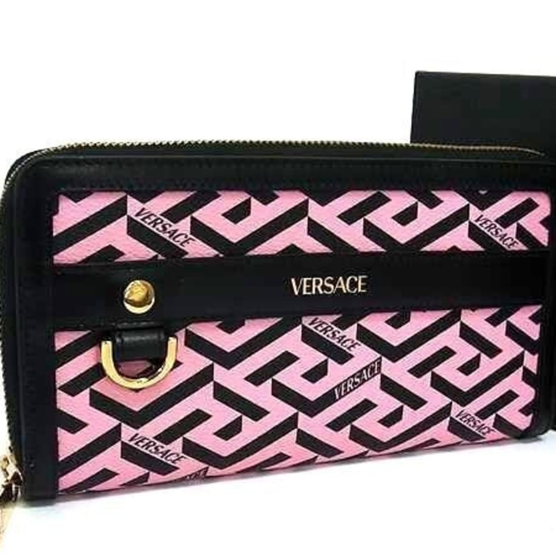 VERSACE Greca Women's Round Long Wallet in Pink and Black Leather: --- Catalog ---Category: SizeSize (HxWxD): 10.8cm x 19.5cm x 2cm / 4.25'' x 7.67'' x 0.78''Category: DesignType: Long wallet (bi-fold)Color: Black, PinkGender: Men,WomenMaterial: Leather Category: Gen