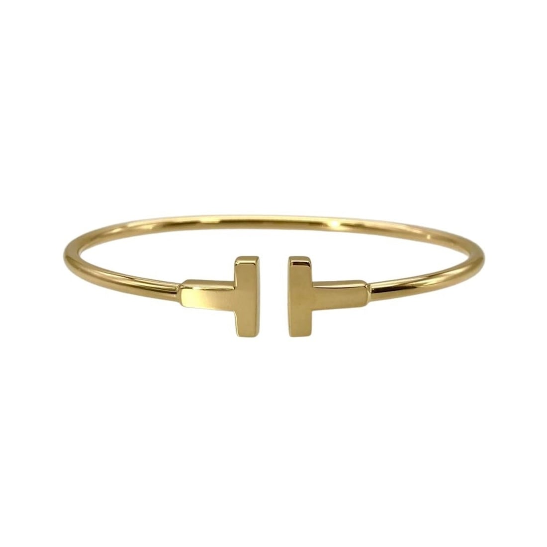 Tiffany & Co. T Wire Bracelet, 18K Yellow Gold, 8.6g, 16cm, Women's.: --- Catalog ---Category: SizeLength: 16cm / 6.29''Category: DesignType: BangleGender: WomenMaterial: Yellow gold (18K)Category: GeneralBrand: Tiffany--- Item List ---Section: ConditionRanking: Rank SA