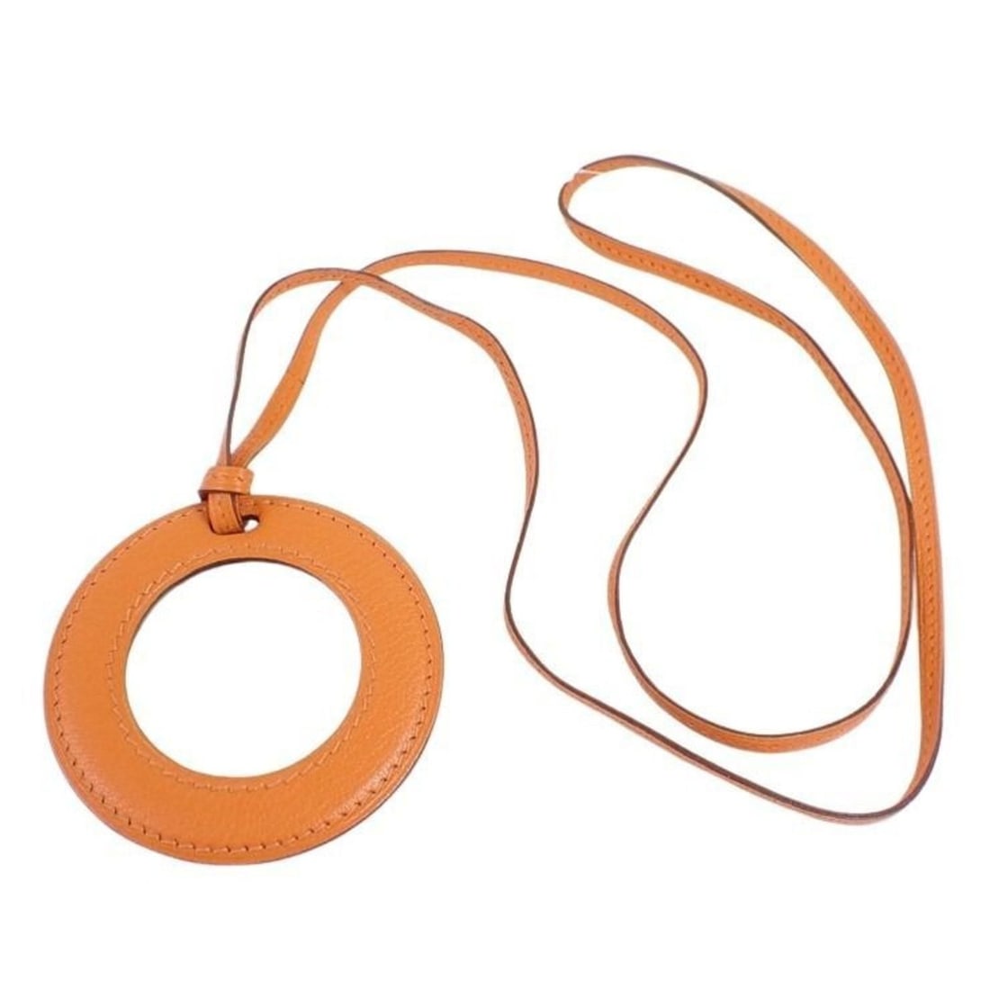 HERMES Necklace in the Pocket Orange Chevre Leather Magnifying Glass Pendant for Men and Women: --- Catalog ---Category: SizeDiameter: 77mm / 3.03''Neck Circumference: 93 cm / 36.61''Category: DesignColor: OrangeGender: Men,Women,UnisexMaterial: Chevre leatherPendant Type: PendantNecklace Type:
