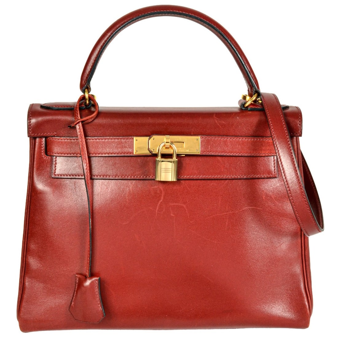 Hermes Kelly 28 handbag, Box Calf leather, ?W stamp, Rouge Vif color, gold hardware, inside: --- Catalog ---Category: SizeHandle Drop: 9.50cm / 3.74''Size (HxWxD): 21cm x 28cm x 11.5cm / 8.26'' x 11.02'' x 4.52''Strap Length: 87cm / 34.25''Category: DesignType: HandbagColor: Rouge vifGender: