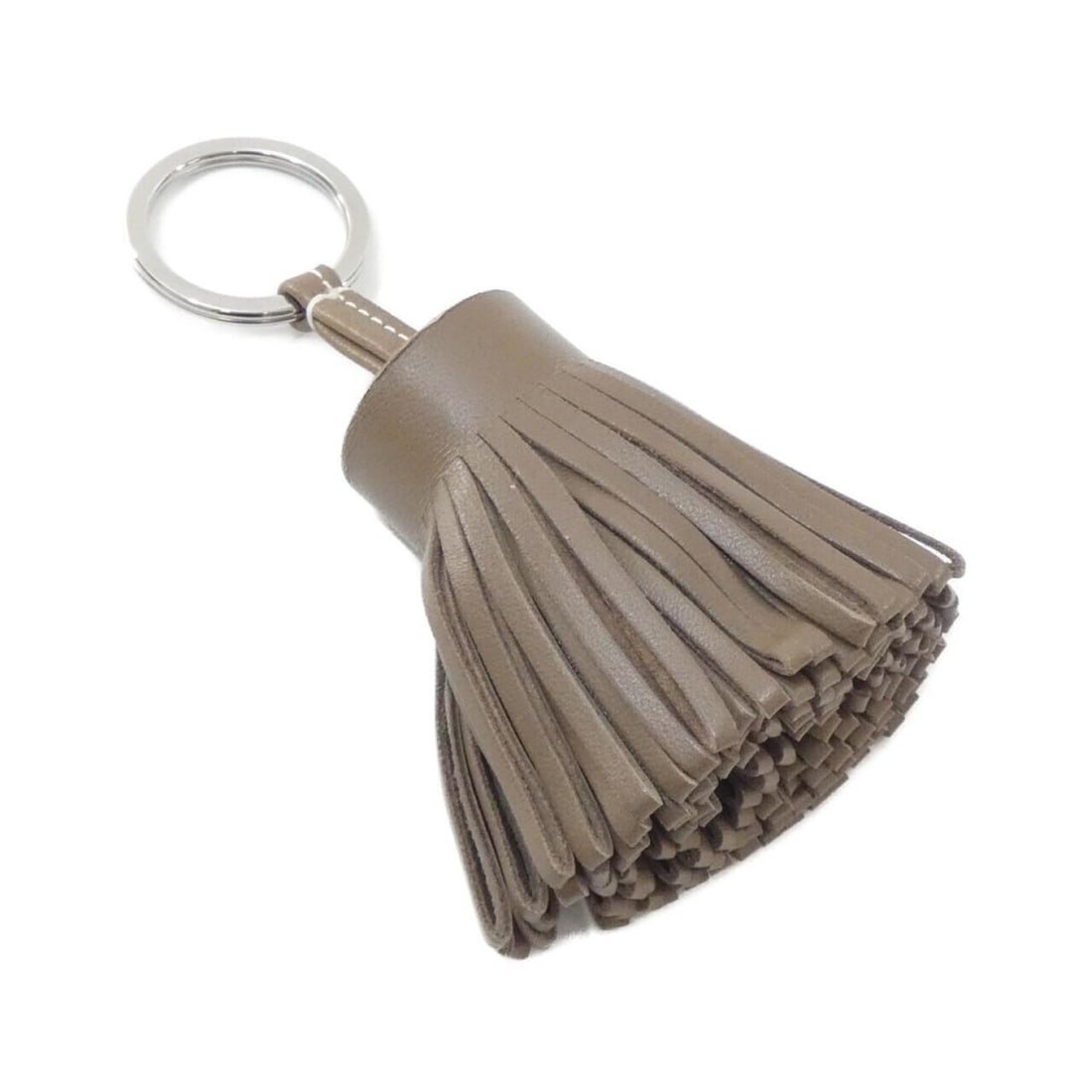Hermes Carmen 077894CJ Keyring: --- Catalog ---Category: DesignType: KeyringColor: Etoupe grayGender: Women,MenMaterial: Agneau MiloCategory: GeneralLine: CarmenBrand: Hermes--- Item List ---Section: ConditionRanking: Rank A Used -