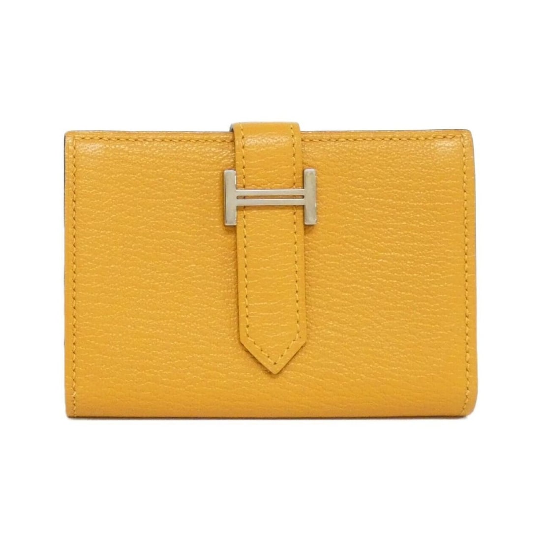 Hermes Bearn Mini 039795CK Wallet: --- Catalog ---Category: SizeSize (HxWxD): 7cm x 10.5cm x 1cm / 2.75'' x 4.13'' x 0.39''Category: DesignType: Wallet (bi-fold)Color: MoutardeGender: Men,WomenMaterial: Chevre leather Category: