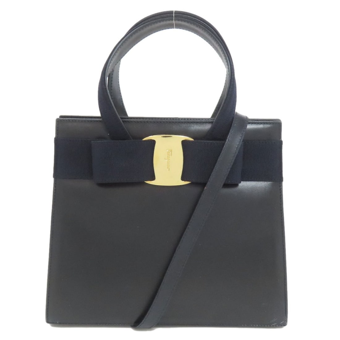 Salvatore Ferragamo Vara Ribbon 2-Way Handbag Leather Women's: --- Catalog ---Category: SizeSize (HxWxD): 21cm x 24.5cm x 10cm / 8.26'' x 9.64'' x 3.93''Category: DesignType: HandbagColor: Black, NavyGender: WomenMaterial: Leather Category: GeneralBrand: Salvator