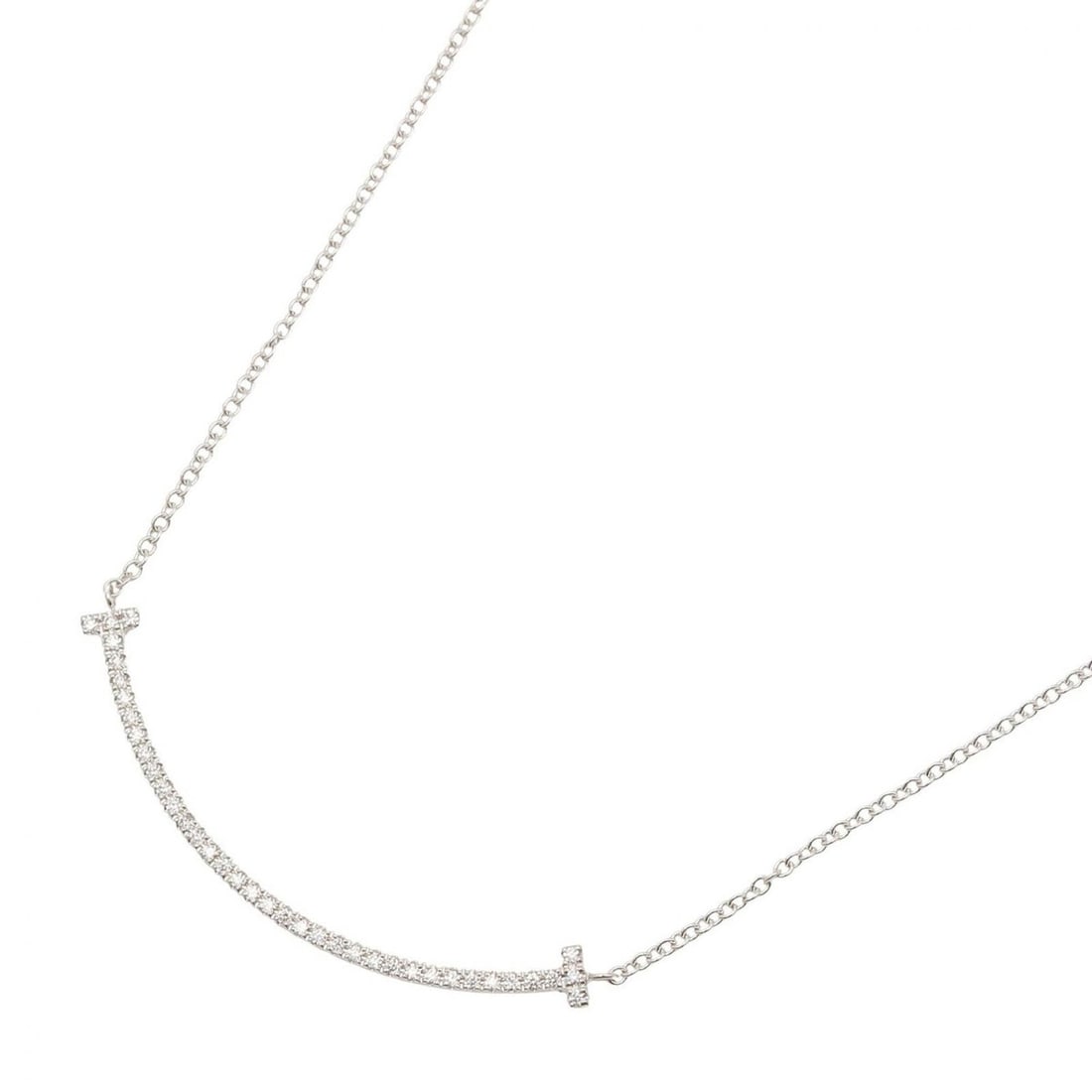 Tiffany & Co. T Smile Small Diamond Necklace, 18K White Gold (18KWG), Diamond, Women's, Clear/Silver: --- Catalog ---Category: SizePendant Size: 3.5mm x 37mm / 0.13'' x 1.45''Neck Circumference: 40.5 cm / 15.94''Category: DesignColor: Clear, SilverGender: WomenMaterial: White gold (18K)Necklace Type: