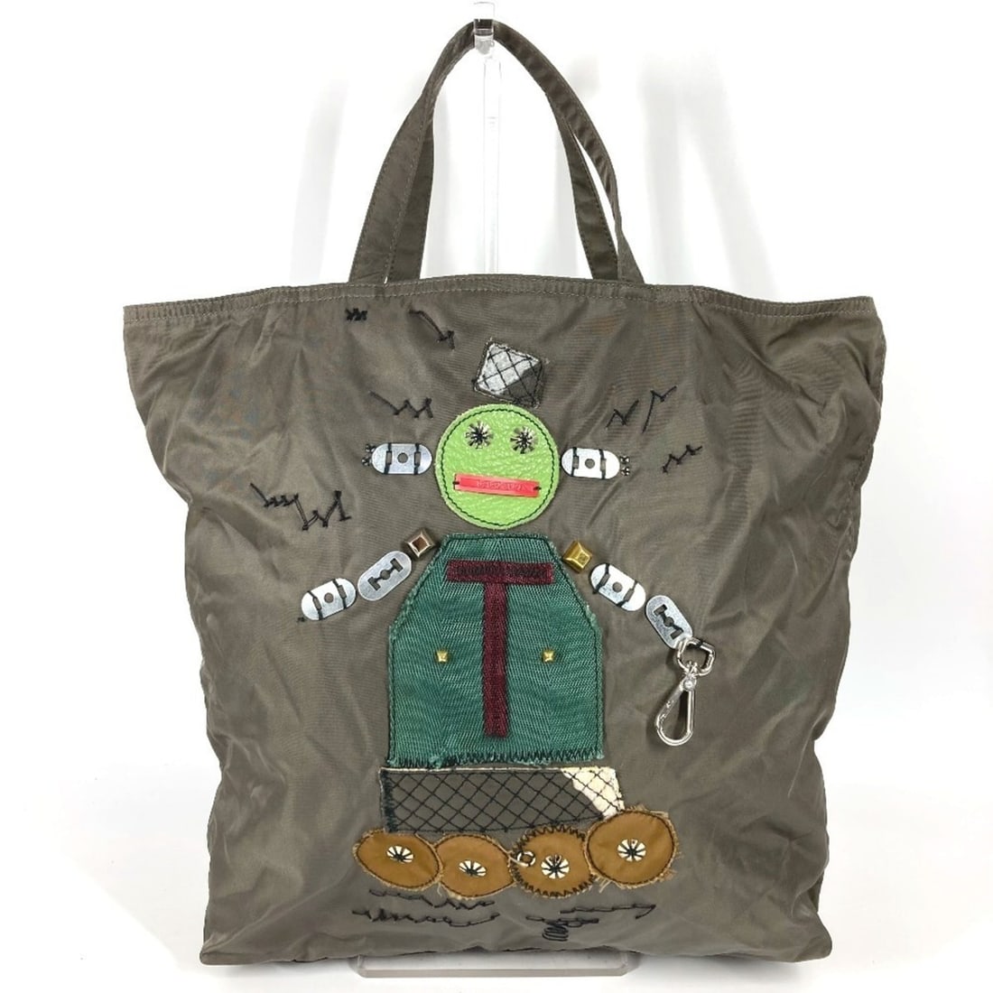 PRADA VA0484 Triangle Logo Plate Robot Bag Tote Handbag Leather Nylon Men's Women's Khaki: --- Catalog ---Category: SizeSize (HxWxD): 36cm x 41cm x 10cm / 14.17'' x 16.14'' x 3.93''Category: DesignType: Handbag, Tote bagColor: KhakiGender: Men,Women,UnisexMaterial: Leather , Nylon Category: