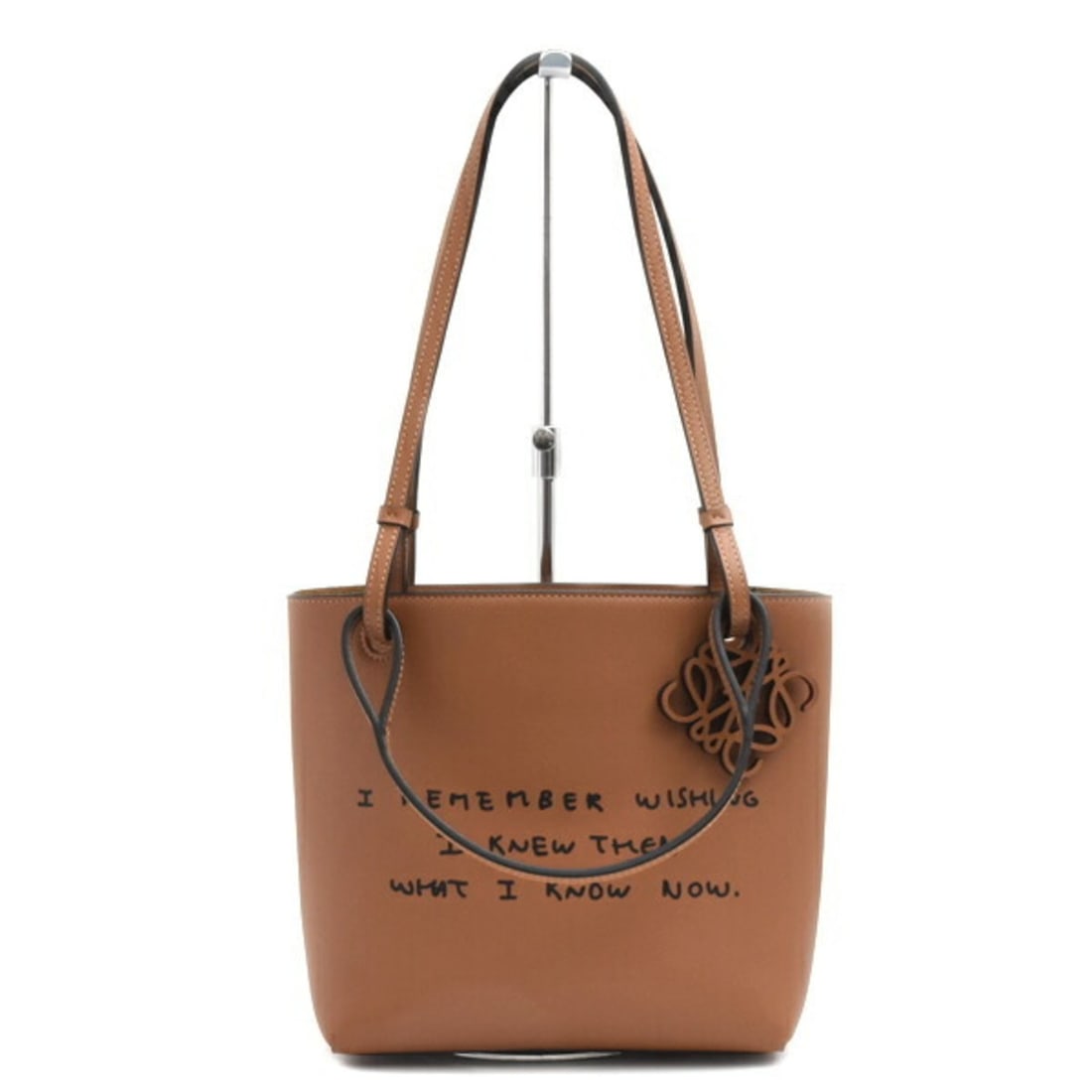 Loewe Women's Double Handle Square Anagram Handbag Tote Bag Calf Leather Tan LOEWE: --- Catalog ---Category: SizeSize (HxWxD): 21cm x 21cm x 10cm / 8.26'' x 8.26'' x 3.93''Category: DesignType: Handbag, Tote bagColor: BrownGender: WomenMaterial: Leather Category: GeneralBrand: LoeweC