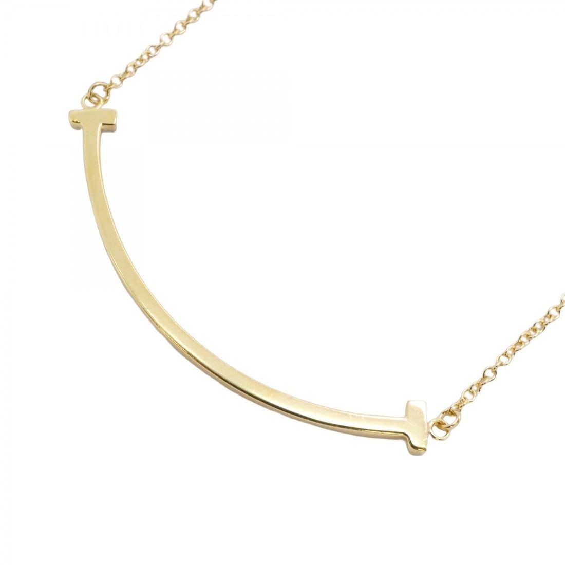 Tiffany & Co. T Smile Small Necklace, 18K Yellow Gold, Women's, P2498841: --- Catalog ---Category: SizePendant Size: 10.1mm x 37.9mm / 0.39'' x 1.49''Neck Circumference: 40.5 cm - 46 cm / 15.94'' - 18.11''Category: DesignGender: WomenMaterial: Yellow gold (18K)Necklace Type