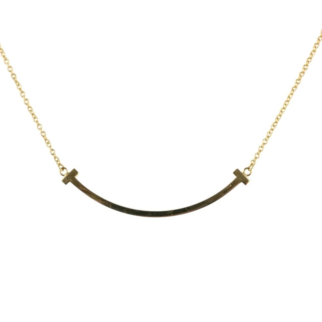 Tiffany & Co. T Smile Small Necklace 750 18K Yellow Gold Women's: --- Catalog ---Category: SizePendant Size: 10mm x 35mm / 0.39'' x 1.37''Neck Circumference: 45 cm / 17.71''Category: DesignColor: GoldGender: WomenMaterial: Yellow gold (18K)Necklace Type: NecklaceCat
