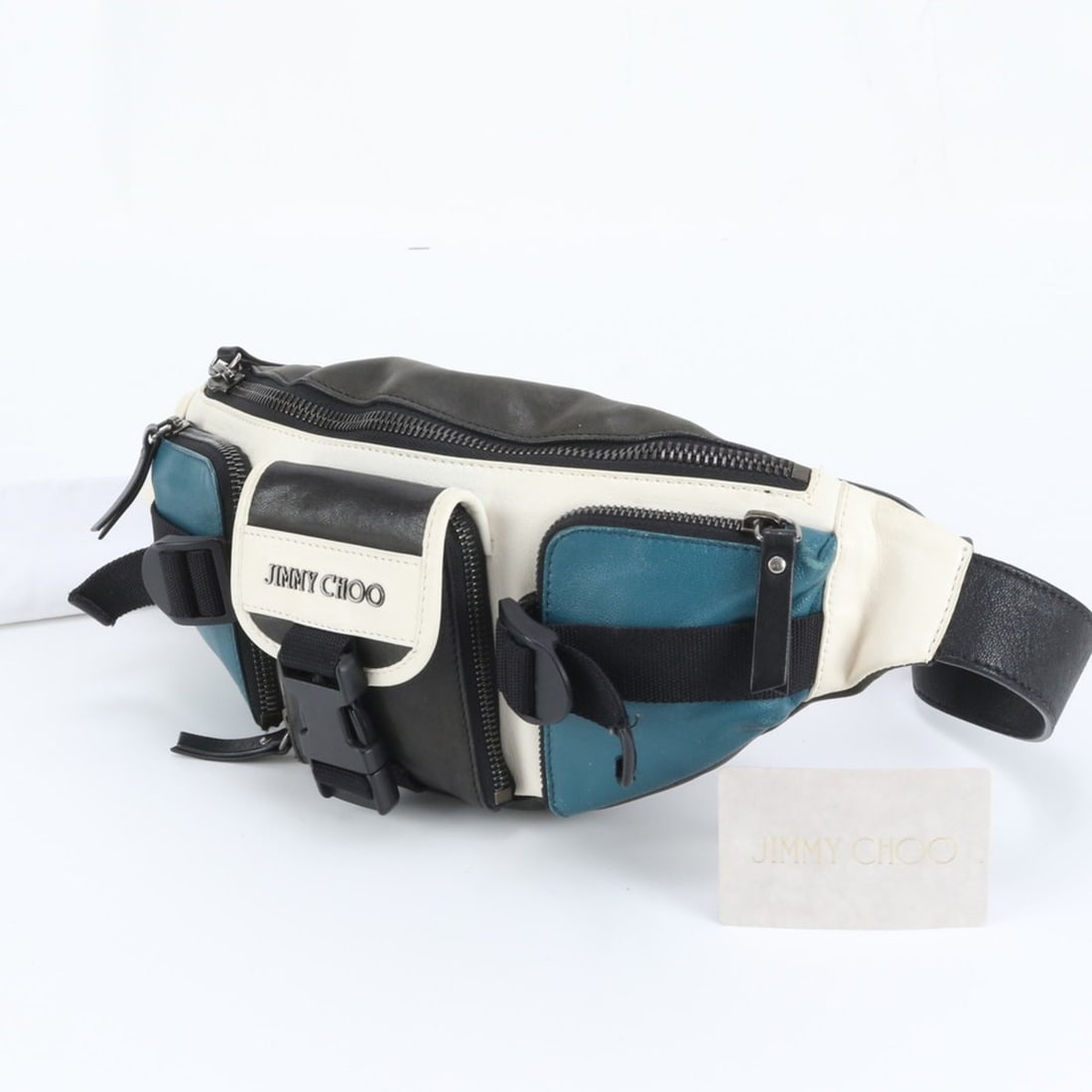 Jimmy Choo Leather Body Bag/Waist Pouch/Shoulder Bag for Men, with Guarantee Card: --- Catalog ---Category: SizeSize (HxWxD): 14cm x 38cm x 4cm / 5.51'' x 14.96'' x 1.57''Category: DesignType: Fanny pack, Sling bagColor: Black, Green, WhiteGender: MenMaterial: Leather Category: Gene