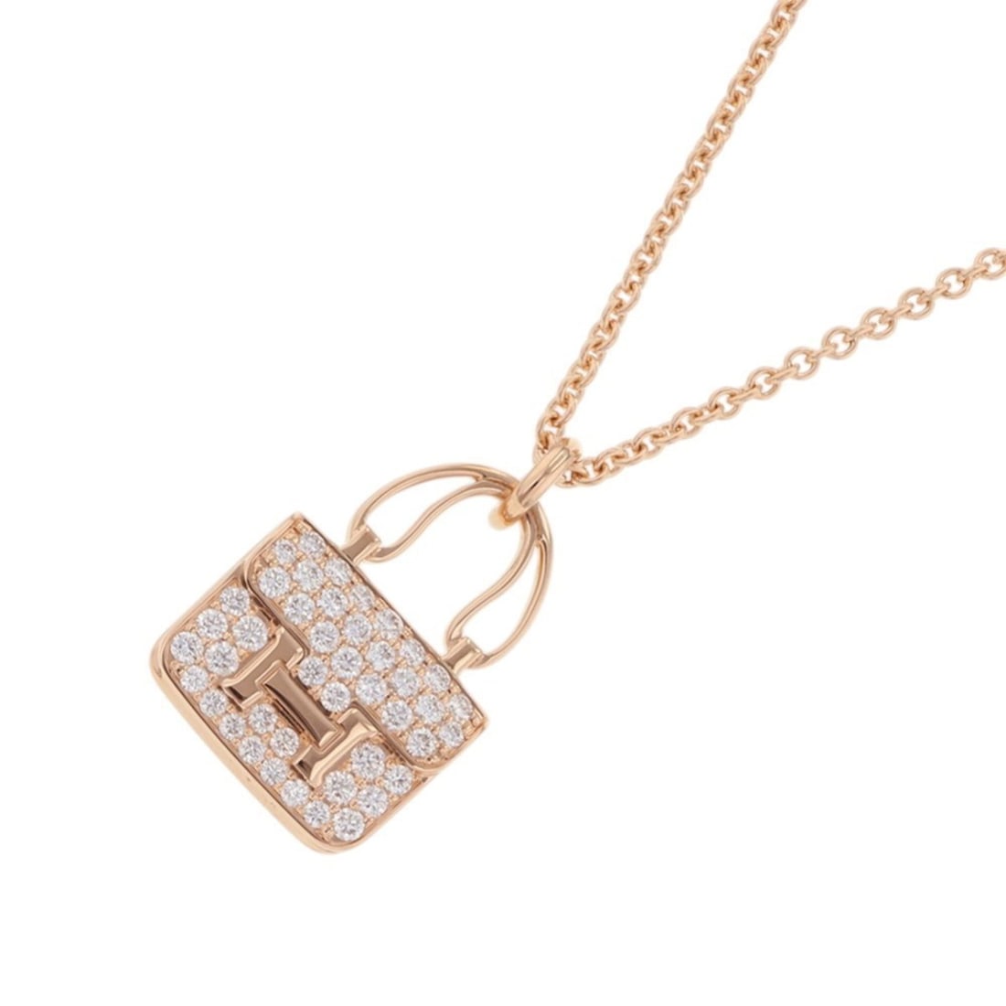 Hermes Amulette Constance Pendant Necklace with 43 Diamonds (0.44ct total) in 18K Pink Gold.: --- Catalog ---Category: SizePendant Size: 21.6mm x 12.8mm / 0.85'' x 0.5''Neck Circumference: 38.5 cm - 40.5 cm / 15.15'' - 15.94''Category: DesignColor: Pink goldStone: DiamondGender: WomenMaterial: