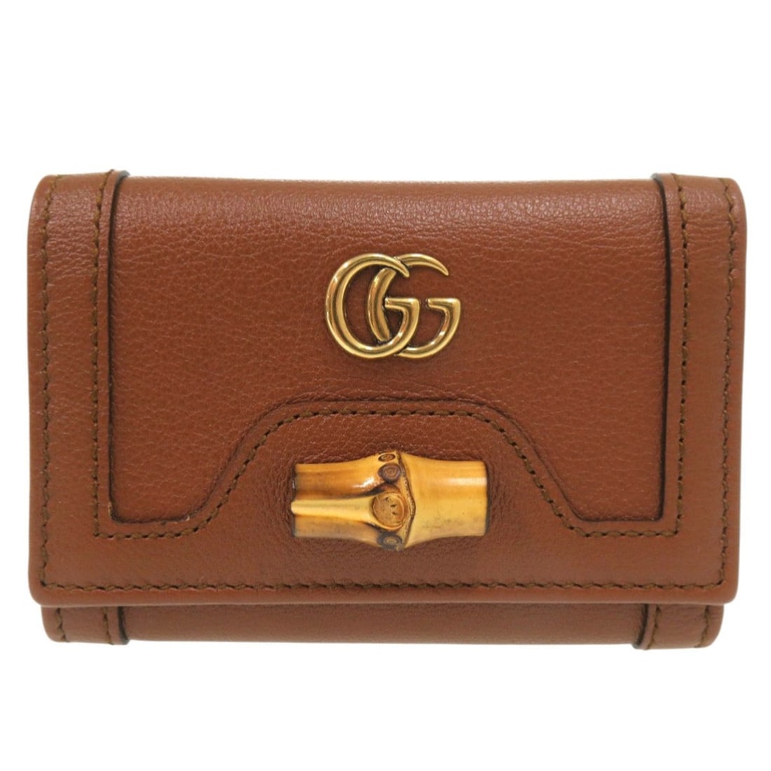 Like New Gucci Diana Bamboo Compact Wallet GG Marmont 658633 2149 Gold Hardware Leather Brown: --- Catalog ---Category: SizeSize (HxWxD): 7.5cm x 10.7cm x 3.5cm / 2.95'' x 4.21'' x 1.37''Category: DesignType: Wallet (tri-fold)Color: BrownGender: WomenMaterial: Leather Category: GeneralMPN: 6586
