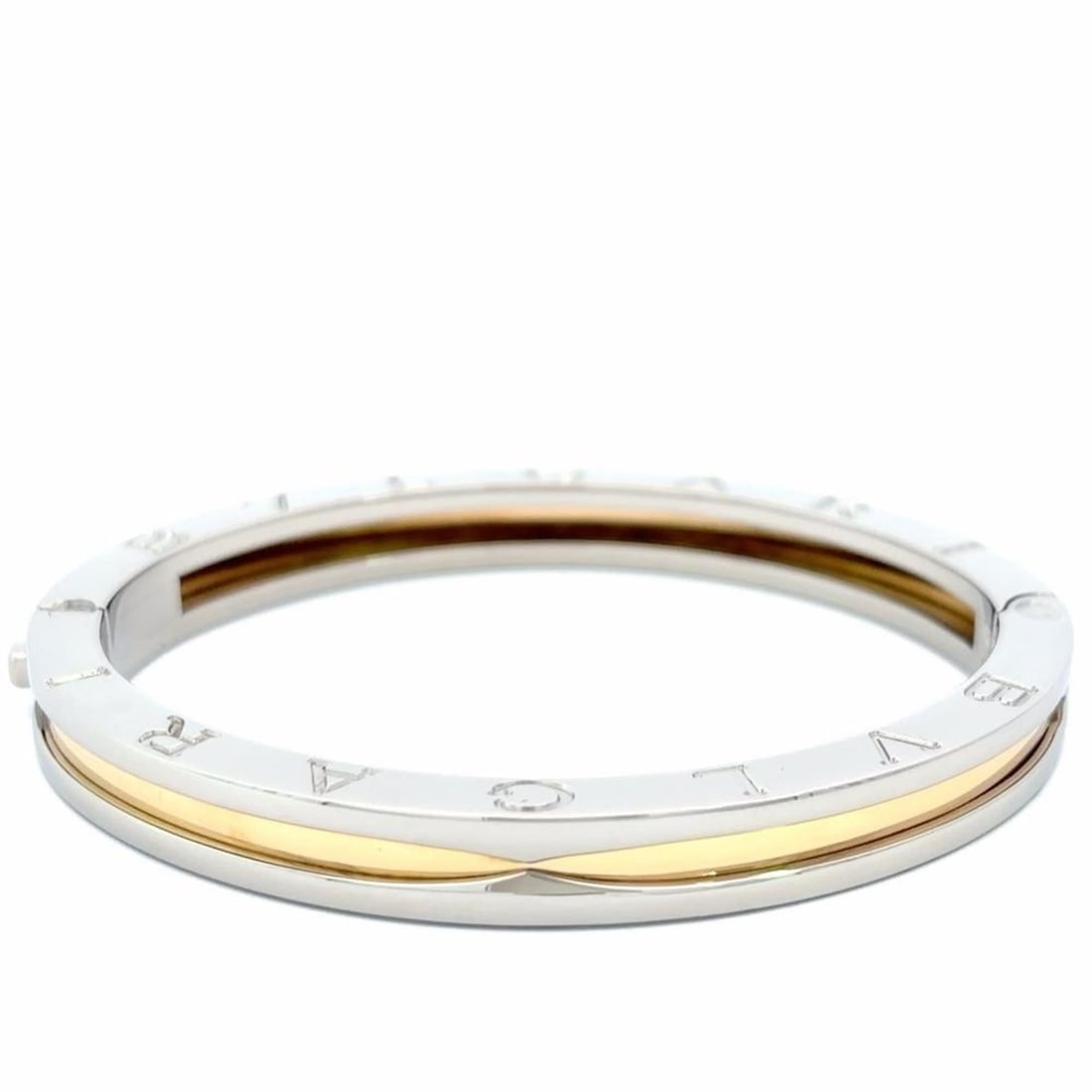 Bvlgari Bulgari B.zero1 Bangle Cuff Bracelet (Combination) for Women: --- Catalog ---Category: SizeLength: 16cm / 6.29''Category: DesignType: BangleGender: WomenMaterial: Stainless steel, Yellow gold (18K)Category: GeneralBrand: Bvlgari--- Item List ---Section: Conditio