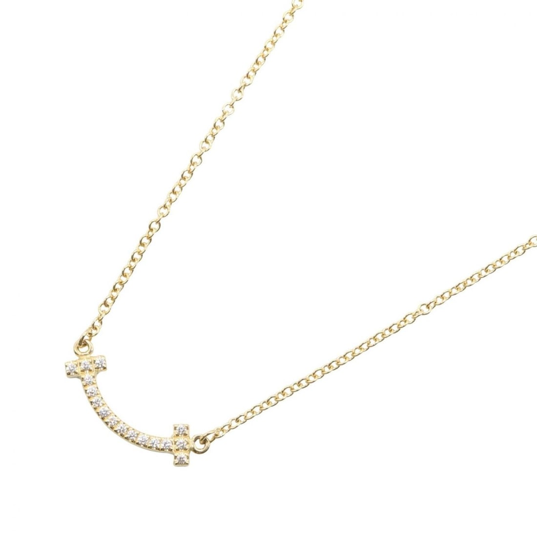 Tiffany & Co. T Smile Mini Diamond Necklace, 18K (Yellow Gold), Diamond, Women's, Gold Tone, Clear: --- Catalog ---Category: SizeNeck Circumference: 40.5 cm - 45.5 cm / 15.94'' - 17.91''Category: DesignColor: Clear, GoldStone: DiamondGender: WomenMaterial: Yellow gold (18K)Necklace Type: NecklaceCat