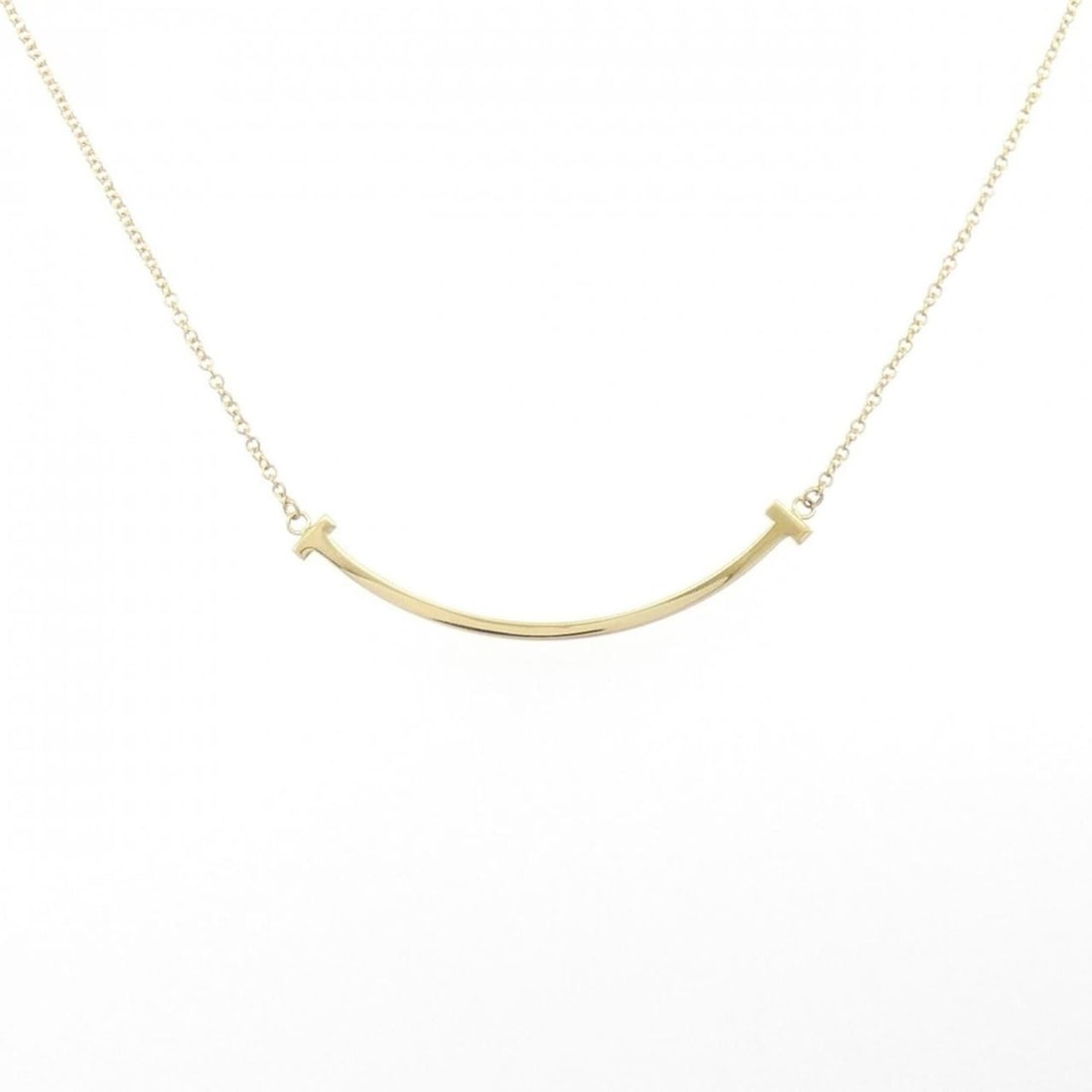 Tiffany T Smile Small Necklace: --- Catalog ---Category: SizePendant Size: 3.6mm x 37.2mm / 0.14'' x 1.46''Neck Circumference: 45 cm / 17.71''Category: DesignColor: Yellow goldGender: WomenMaterial: Yellow goldPendant Type: