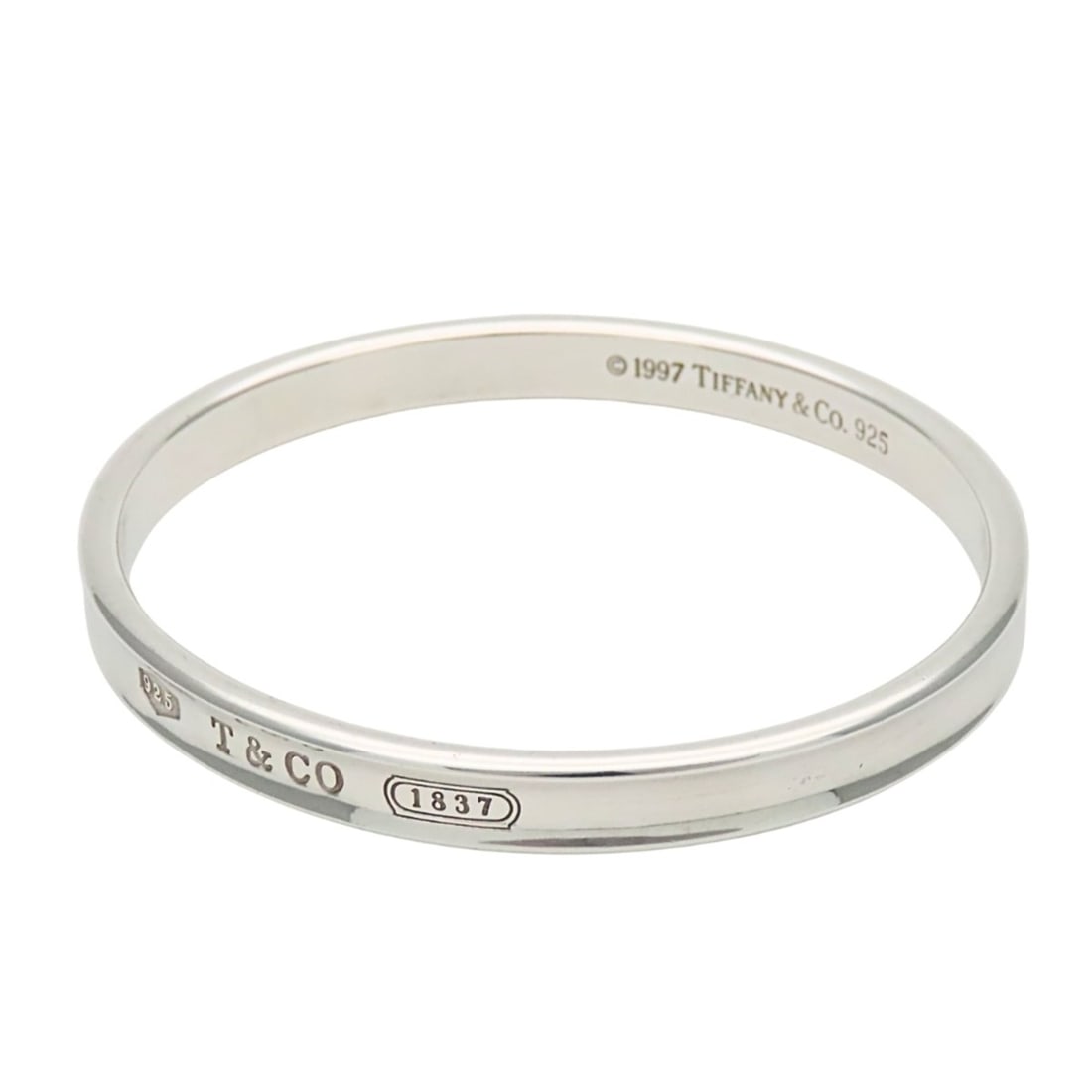 Tiffany & Co. Bangle 1837 SV925 Bracelet for Women: --- Catalog ---Category: SizeWidth: 7mm / 0.27''Length: 18cm / 7.08''Weight: 32.7g / 1.15oz.Category: DesignType: BangleColor: SilverGender: WomenMaterial: Silver 925Category: GeneralBrand: Tiffany---
