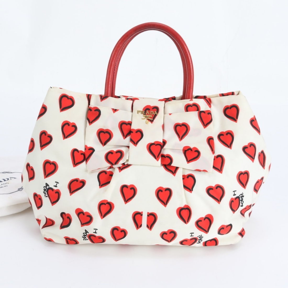 Prada Tessuto Nylon Ribbon Motif Heart Pattern Leather Handbag Tote Bag for Women: --- Catalog ---Category: SizeSize (HxWxD): 24cm x 37cm x 15cm / 9.44'' x 14.56'' x 5.9''Handle Length: 27cm / 10.62''Category: DesignType: Handbag, Tote bagColor: Red color, WhiteGender: WomenMaterial