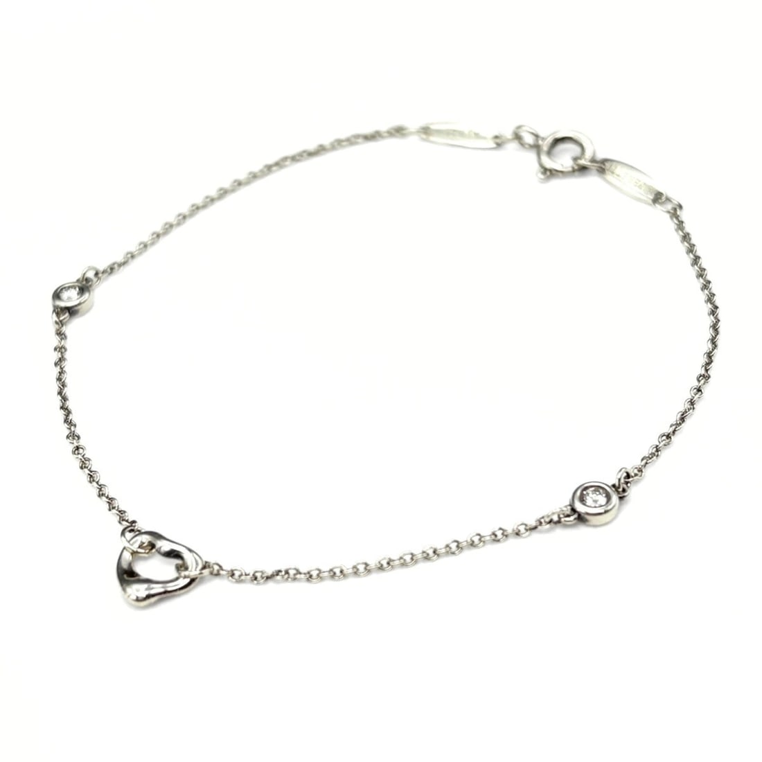 Tiffany & Co. Diamond by the Yard Open Heart Bracelet, Silver, 2-piece set, Elsa Peretti design,: --- Catalog ---Category: SizeLength: 18cm / 7.08''Category: DesignType: Charm braceletColor: SilverGender: WomenMaterial: SilverCategory: GeneralBrand: Tiffany--- Item List ---Section: ConditionRankin