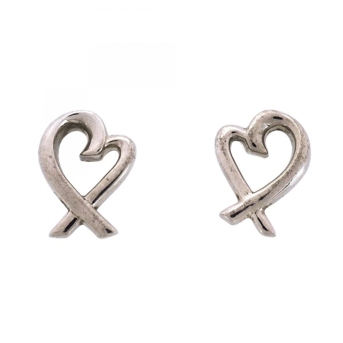 Tiffany & Co. Loving Heart Sterling Silver Earrings for Women: --- Catalog ---Category: SizeSize (HxWxD): 10.10mm x 7.80mm / 0.40'' x 0.31''Category: DesignType: Stud earringsGender: WomenMaterial: Silver 925Category: GeneralBrand: Tiffany--- Item List ---Section