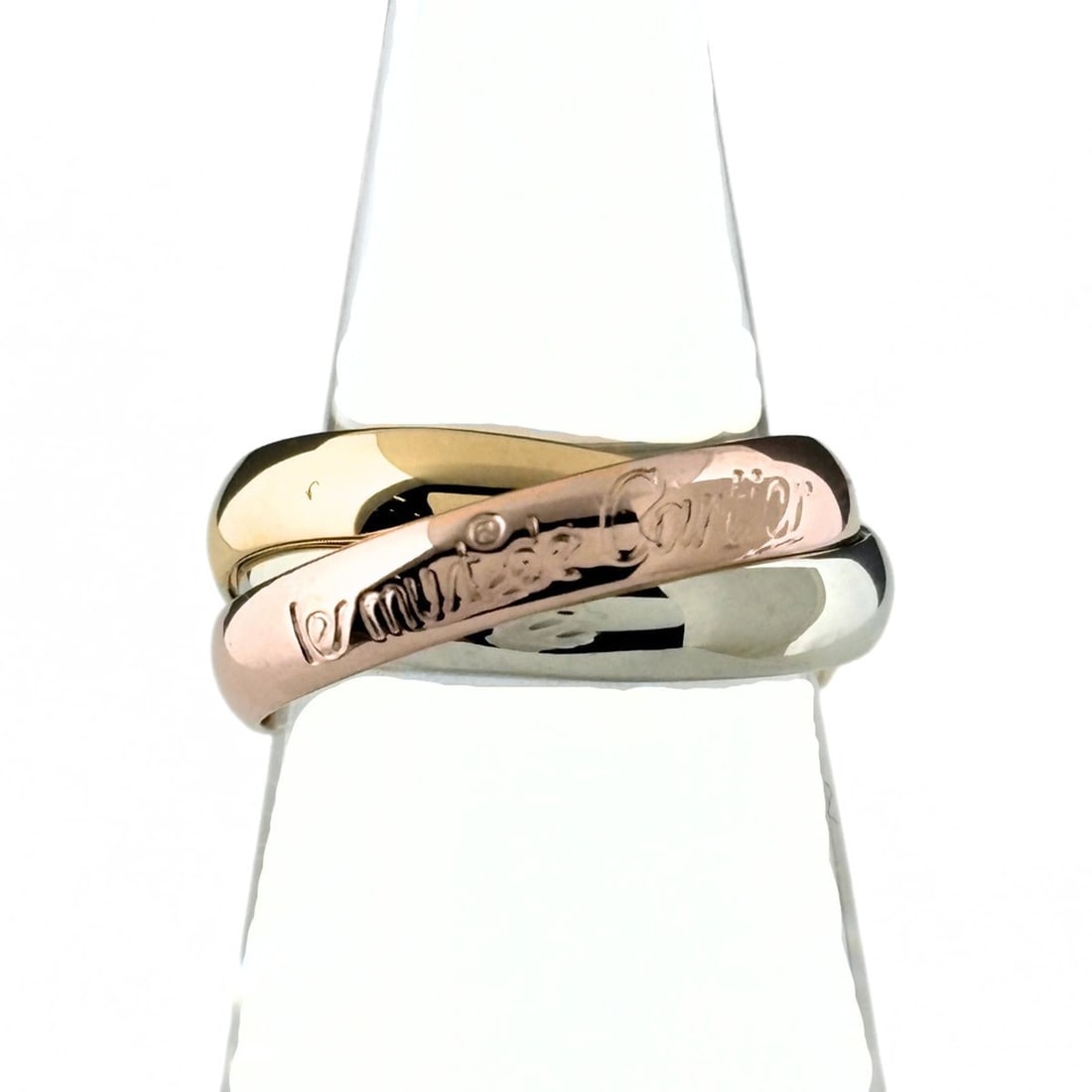 Cartier Trinity Ring, available in yellow gold (YG), pink (PG), and white (WG). Three-color design,: --- Catalog ---Category: SizeJP Size: 9US Size: 5Category: DesignColor: Pink, White, YellowGender: WomenCategory: GeneralBrand: Cartier--- Item List ---Section: ConditionRanking: Rank AB Used - Traces