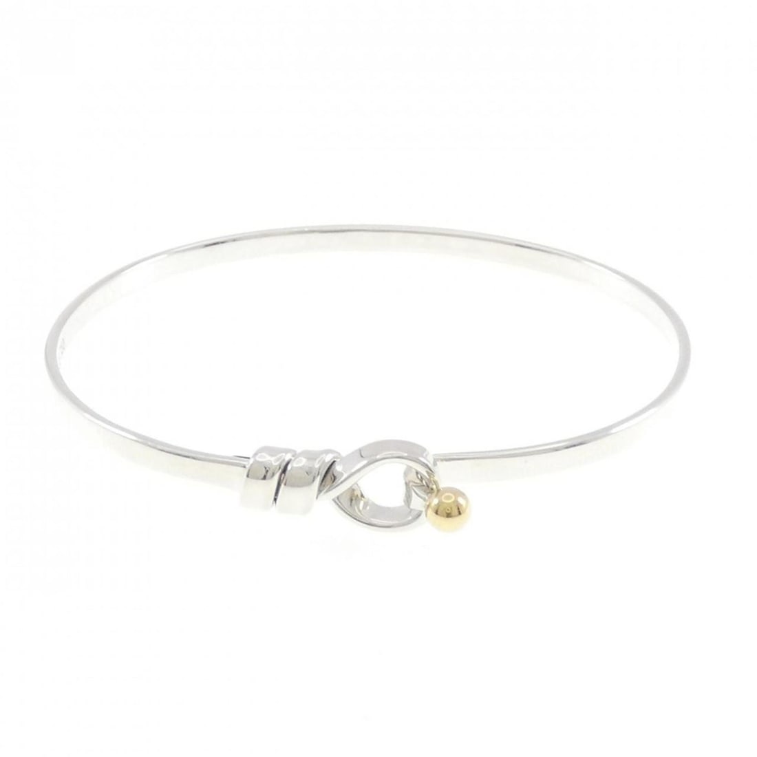 Tiffany Hook & Eye Bangle: --- Catalog ---Category: SizeLength: 17.5cm / 6.88''Category: DesignType: BangleColor: Silver, Yellow goldGender: WomenMaterial: Silver 925, Yellow gold (18K)Category: GeneralBrand: Tiffany--- Item