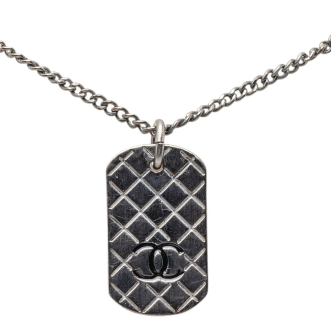 Chanel Matelassé Dog Tag Coco Mark Necklace, Silver Metal, Women's CHANEL: --- Catalog ---Category: SizePendant Size: 26.1mm x 15.2mm / 1.02'' x 0.59''Neck Circumference: 41 cm / 16.14''Category: DesignColor: SilverGender: WomenMaterial: MetalNecklace Type: NecklaceCategory: