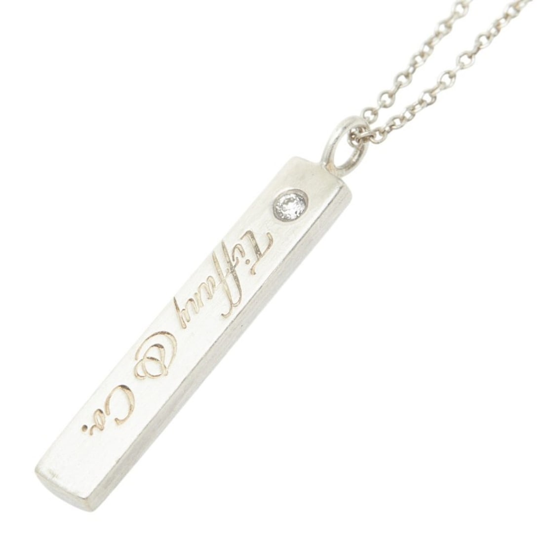 Tiffany & Co. Notes Bar Logo Diamond Plate Pendant Necklace, 1PD, Sterling Silver (SV925), with: --- Catalog ---Category: SizeWeight: 3.2g / 0.11oz.Pendant Size: 28.8mm x 4.3mm / 1.13'' x 0.16''Neck Circumference: 41 cm / 16.14''Category: DesignColor: SilverStone: DiamondGender: WomenMaterial: Si
