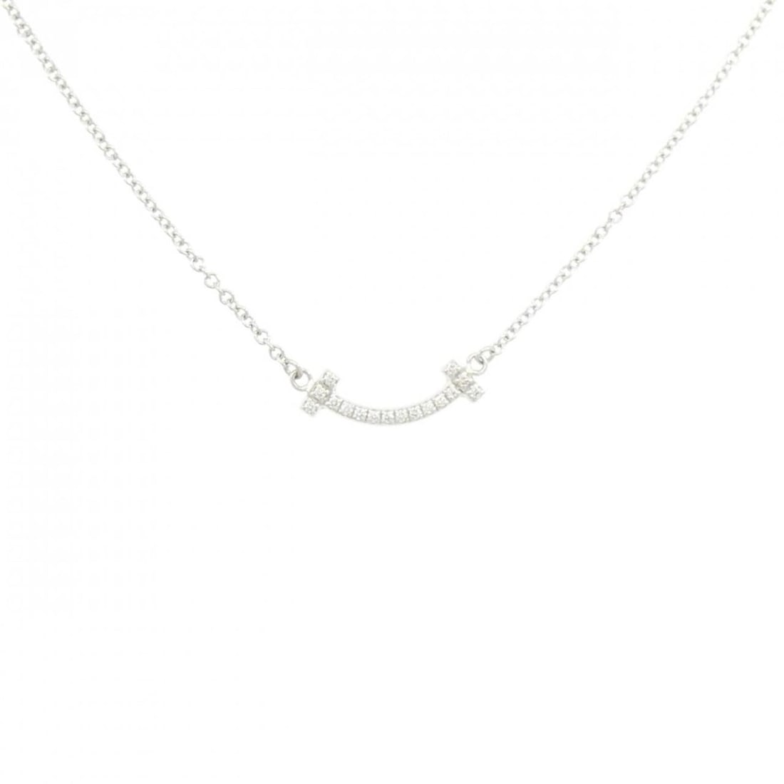 Tiffany T Smile Mini Necklace: --- Catalog ---Category: SizePendant Size: 3.5mm x 13.5mm / 0.13'' x 0.53''Neck Circumference: 41 cm - 46 cm / 16.14'' - 18.11''Category: DesignColor: White goldStone: DiamondGender: WomenMaterial: