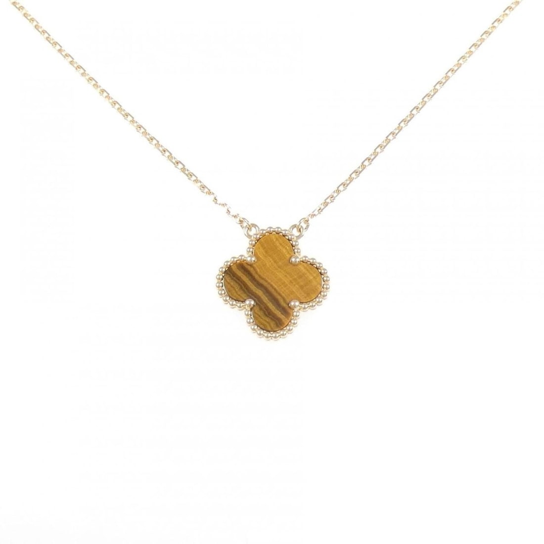 Van Cleef & Arpels Vintage Alhambra Necklace: --- Catalog ---Category: SizePendant Size: 14.8mm x 14.8mm / 0.58'' x 0.58''Neck Circumference: 37 cm - 42 cm / 14.56'' - 16.53''Category: DesignColor: Yellow goldStone: Tiger's eyeGender: WomenMateri