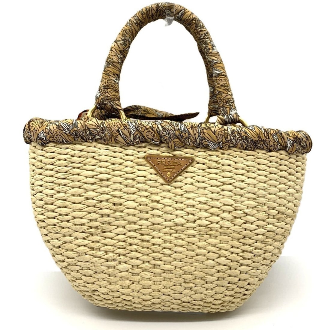 Prada Raffia Frill Basket Bag, Natural Silk Print PRADA: --- Catalog ---Category: SizeSize (HxWxD): 23.5cm x 32cm x 14cm / 9.25'' x 12.59'' x 5.51''Category: DesignType: HandbagClosure: OpenMaterial: Raffia Category: GeneralBrand: Prada--- Item List ---Sect