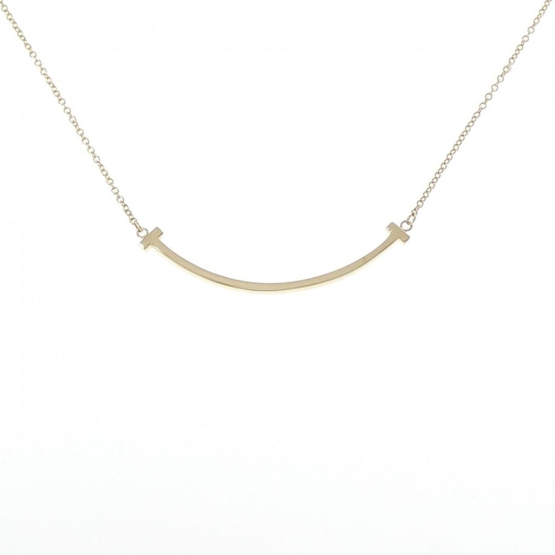 Tiffany T Smile Small Necklace: --- Catalog ---Category: SizePendant Size: 3.6mm x 37.3mm / 0.14'' x 1.46''Neck Circumference: 41 cm - 47 cm / 16.14'' - 18.5''Category: DesignGender: WomenMaterial: Yellow gold (18K)Pendant Type:
