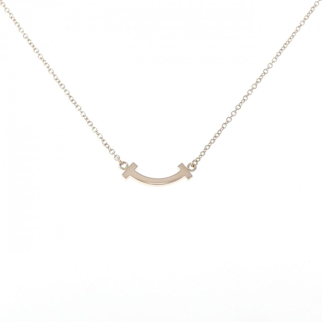 Tiffany T Smile Mini Necklace: --- Catalog ---Category: SizePendant Size: 4.6mm x 13mm / 0.18'' x 0.51''Neck Circumference: 41 cm - 46 cm / 16.14'' - 18.11''Category: DesignGender: WomenMaterial: Pink gold (18K)Pendant Type: