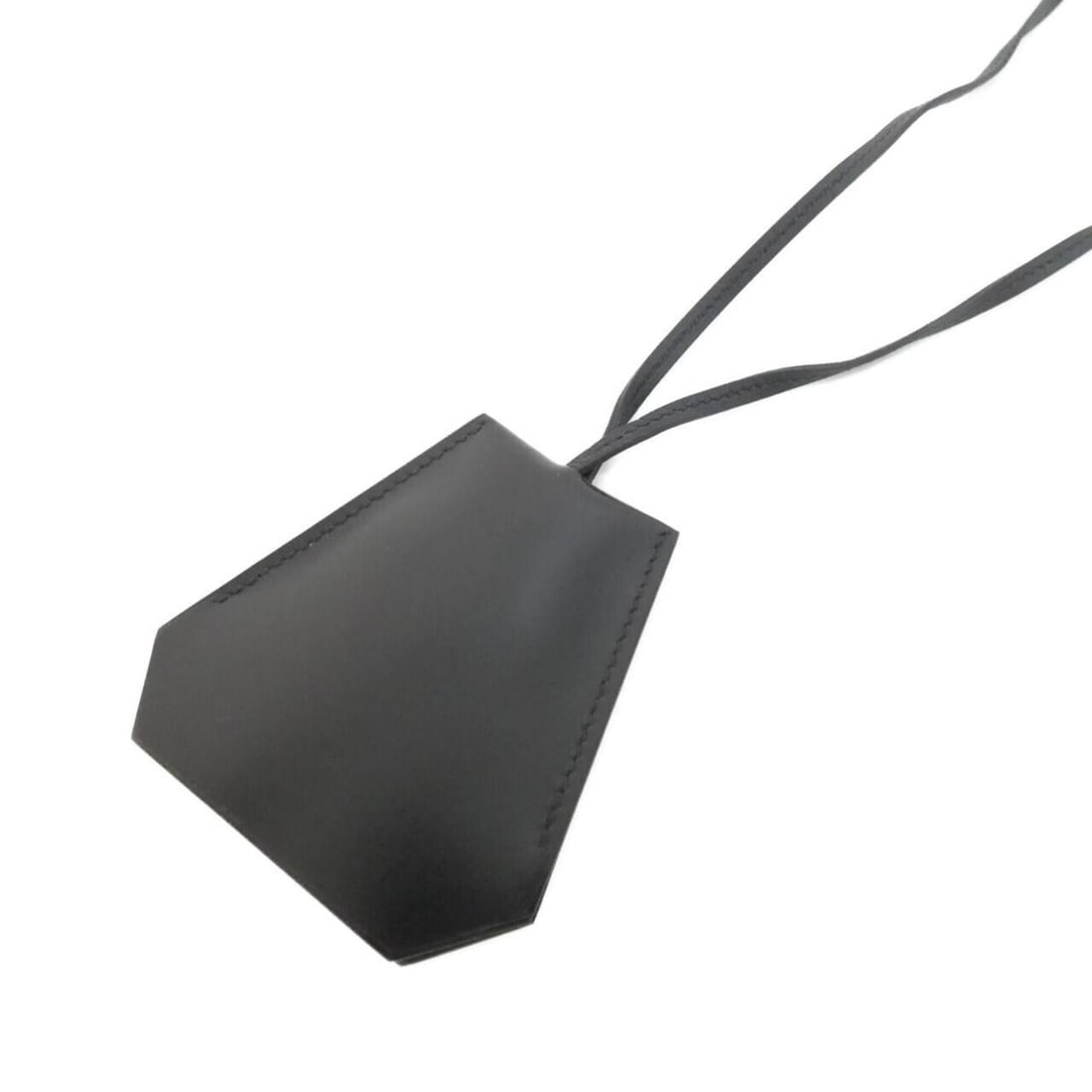 Hermes Clochette 074214CJ Necklace: --- Catalog ---Category: SizePendant Size: 80mm x 78mm / 3.14'' x 3.07''Neck Circumference: 103 cm / 40.55''Category: DesignColor: BlackGender: Men,WomenMaterial: Box calf leatherNecklace Type: