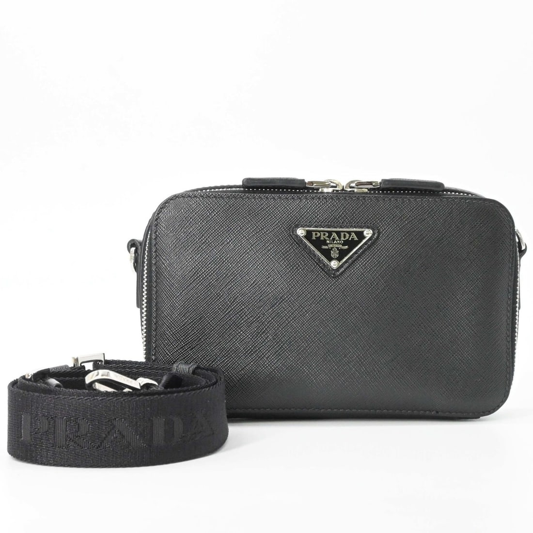 PRADA Brick Saffiano Leather Shoulder Bag, Black, 2VH173: --- Catalog ---Category: SizeSize (HxWxD): 11cm x 18.5cm x 4cm / 4.33'' x 7.28'' x 1.57''Category: DesignType: Shoulder bagColor: BlackGender: WomenMaterial: Saffiano triangle Category: GeneralMPN: 2V