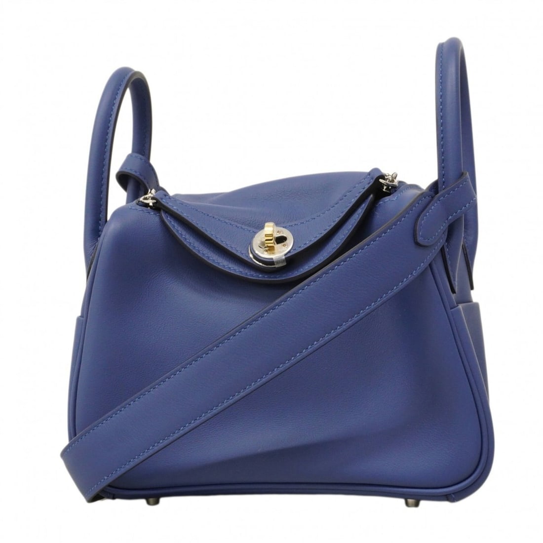 Hermes Lindy Mini Swift Blue Tie Handbag (K stamp) - Ladies: --- Catalog ---Category: SizeSize (HxWxD): 13cm x 18cm x 9.5cm / 5.11'' x 7.08'' x 3.74''Category: DesignType: HandbagColor: BlueGender: WomenMaterial: Swift leather Hardware Color: SilverCategory: Ge