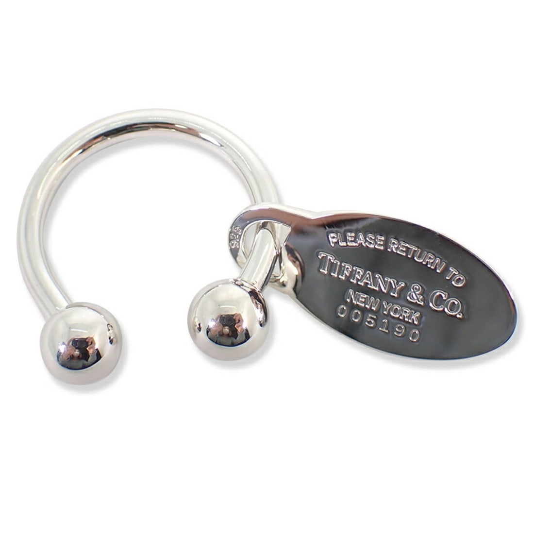 TIFFANY & Co. 925 Return to Tiffany Oval Tag Keyring: --- Catalog ---Category: DesignType: KeyringGender: Men,WomenMaterial: Sterling silver 925Category: GeneralBrand: Tiffany--- Item List ---Section: ConditionRanking: Rank SA Used - Hardly any traces