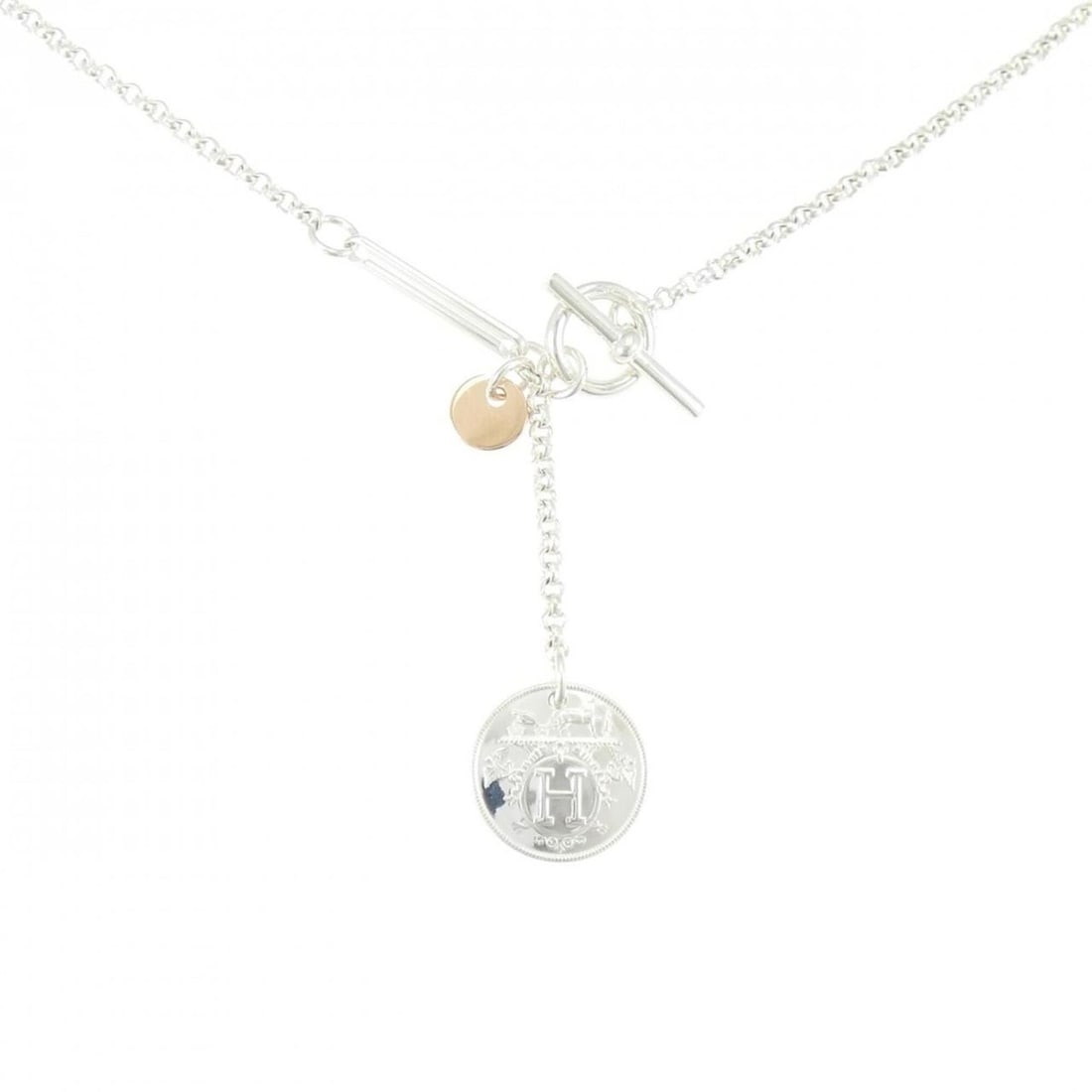 Hermes Hermès Ex-Libris Necklace: --- Catalog ---Category: SizePendant Size: 40.7mm x 13mm / 1.6'' x 0.51''Neck Circumference: 41 cm / 16.14''Category: DesignColor: Pink gold, SilverGender: WomenMaterial: Pink gold (18K), Silver