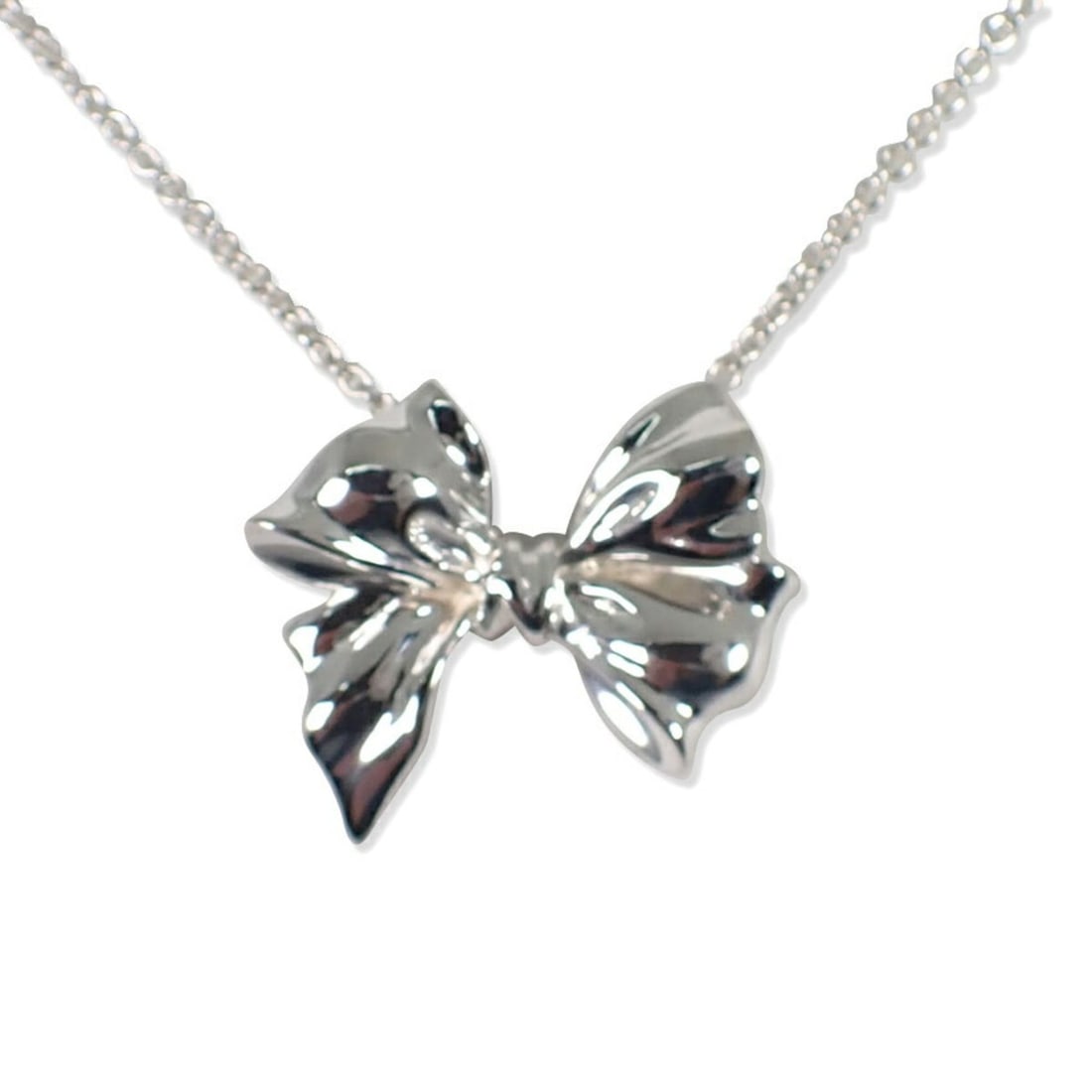 TIFFANY & Co. 925 Ribbon Motif Necklace Pendant: --- Catalog ---Category: SizePendant Size: 22.6mm x 26.4mm / 0.88'' x 1.03''Neck Circumference: 49 cm / 19.29''Category: DesignGender: WomenMaterial: Sterling silver 925Pendant Type: PendantNecklace