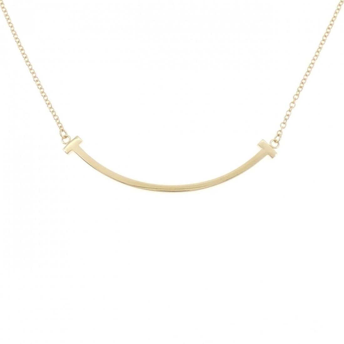 Tiffany T Smile Small Necklace: --- Catalog ---Category: SizePendant Size: 3.6mm x 36.9mm / 0.14'' x 1.45''Neck Circumference: 41 cm - 46 cm / 16.14'' - 18.11''Category: DesignGender: WomenMaterial: Yellow gold (18K)Pendant Type: