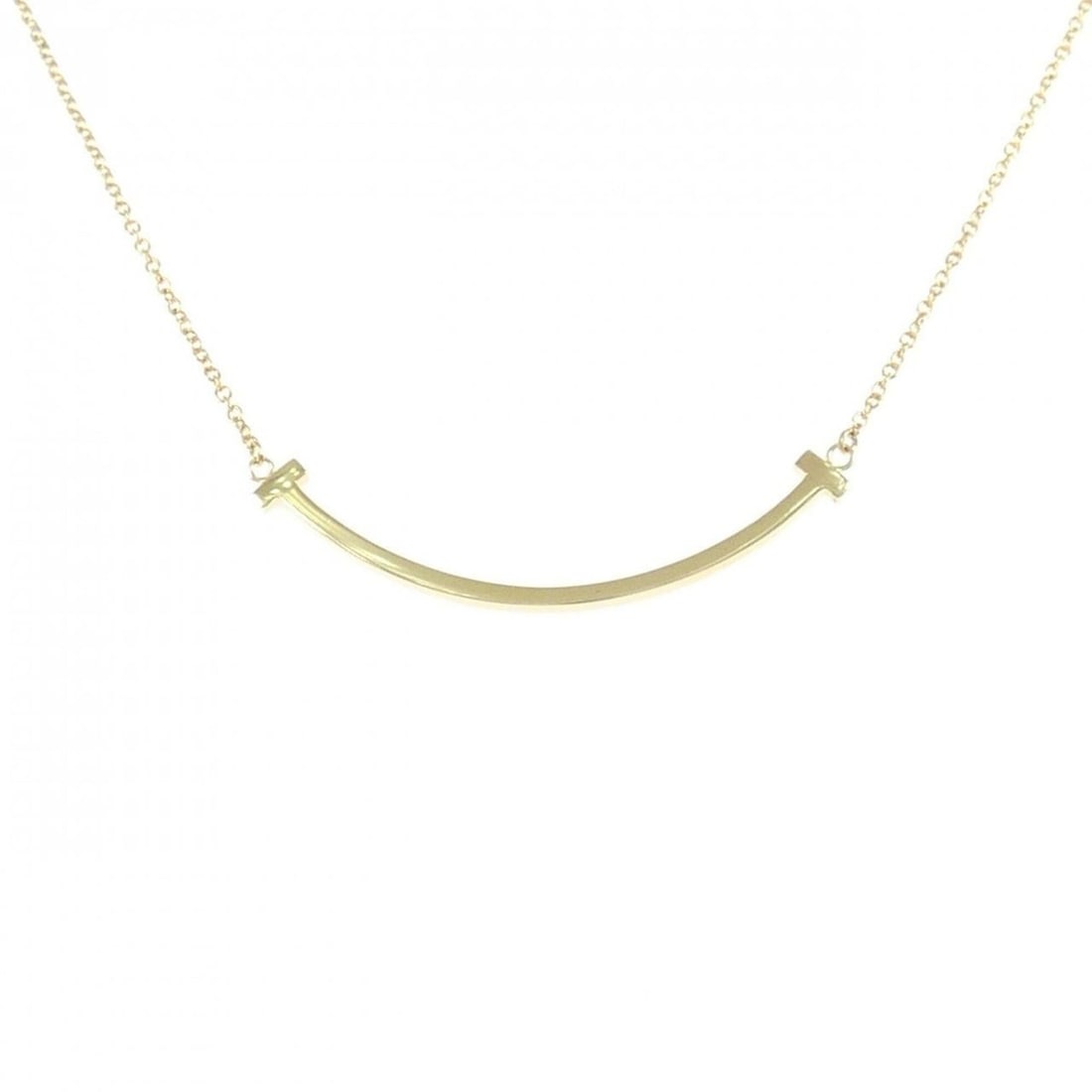 Tiffany T Smile Small Necklace: --- Catalog ---Category: SizePendant Size: 3.6mm x 37mm / 0.14'' x 1.45''Neck Circumference: 40 cm - 45 cm / 15.74'' - 17.71''Category: DesignGender: WomenMaterial: Yellow gold (18K)Pendant Type: