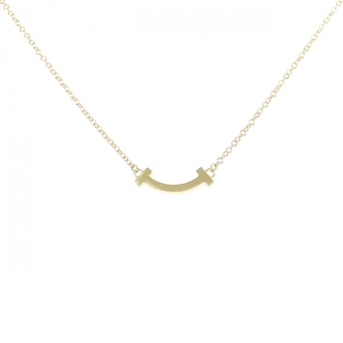 Tiffany T Smile Mini Necklace: --- Catalog ---Category: SizePendant Size: 3.6mm x 13.5mm / 0.14'' x 0.53''Neck Circumference: 41 cm - 46 cm / 16.14'' - 18.11''Category: DesignGender: WomenMaterial: Yellow gold (18K)Pendant Type: