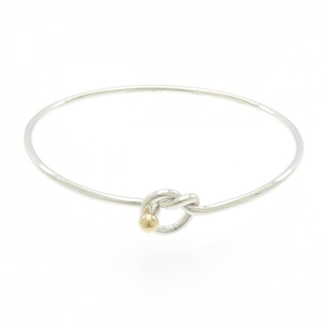 Tiffany & Co. Flat Wire Hook Eye Heart Bangle: --- Catalog ---Category: SizeLength: 16.5cm / 6.49''Category: DesignType: Charm braceletGender: WomenMaterial: Silver 925, Yellow gold (18K)Category: GeneralBrand: Tiffany--- Item List ---Section: Con