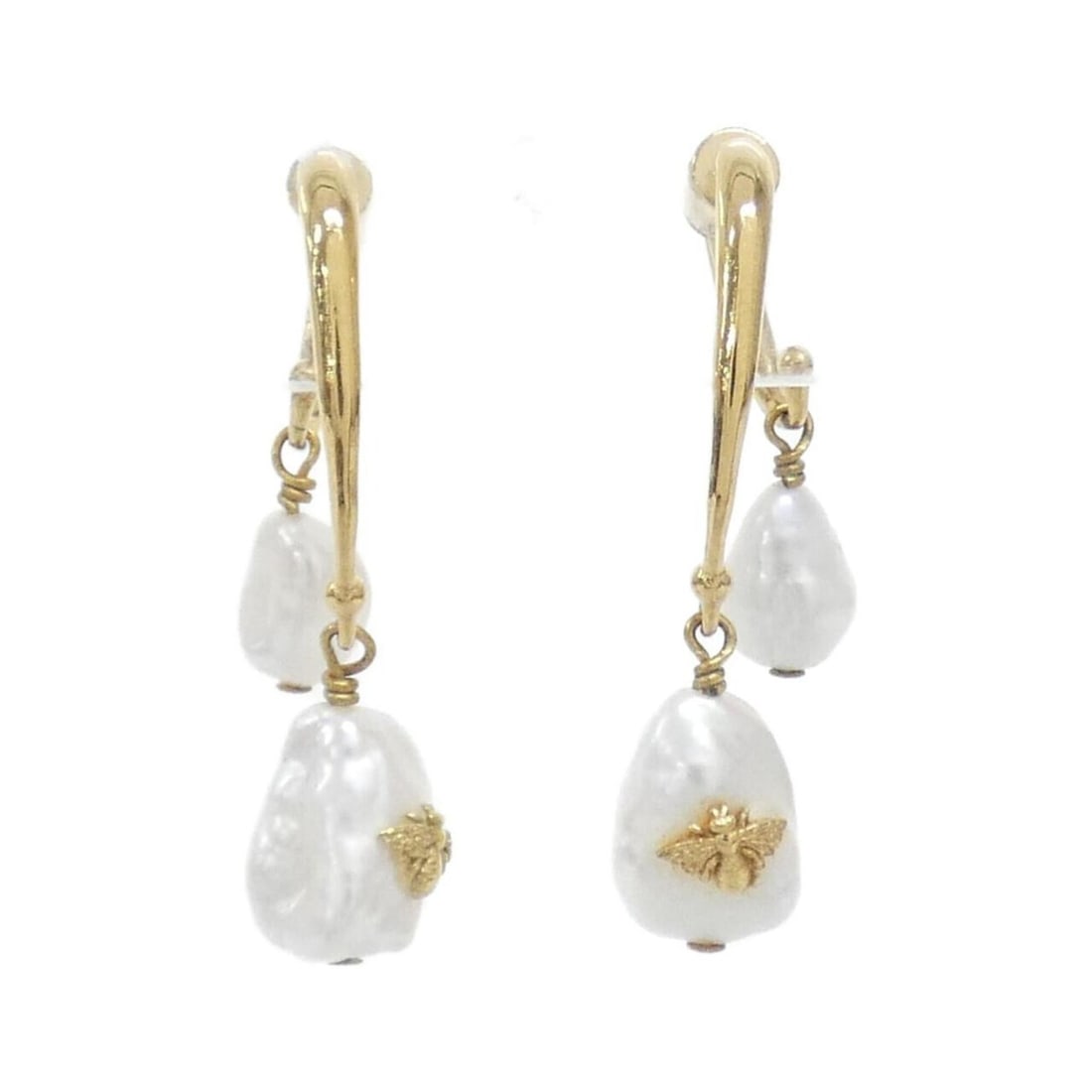 Christian Dior earrings: --- Catalog ---Category: SizeSize (HxWxD): 38.00mm x 9.00mm / 1.50'' x 0.35''Category: DesignType: Stud earringsColor: Gold, WhiteGender: WomenCategory: GeneralBrand: Christian Dior--- Item List ---Se
