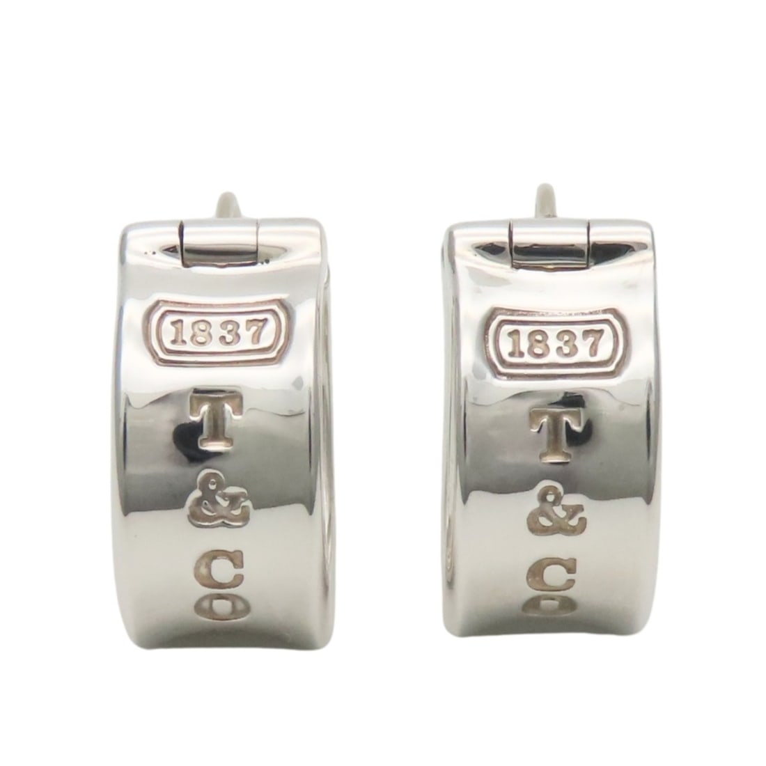 Tiffany & Co. 1837 Sterling Silver Hoop Earrings for Women: --- Catalog ---Category: SizeSize (HxWxD): 18.00mm x 9.00mm / 0.71'' x 0.35''Category: DesignType: Clip earringsColor: SilverGender: WomenMaterial: Silver 925Category: GeneralBrand: Tiffany--- Item Li