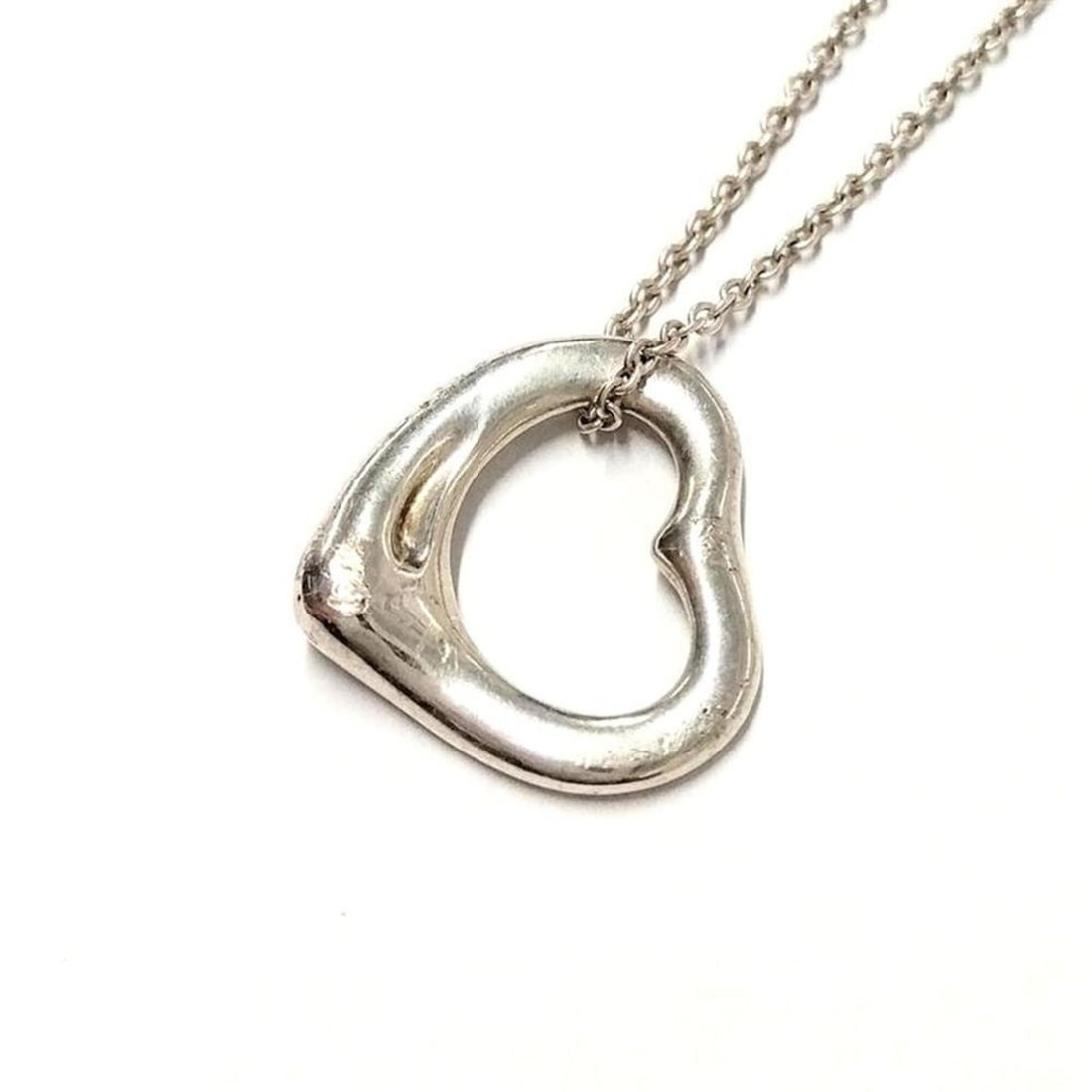 Tiffany & Co. Elsa Peretti Open Heart Necklace, Sterling Silver 925, 3.1g: --- Catalog ---Category: SizePendant Size: 13mm x 11mm / 0.51'' x 0.43''Neck Circumference: 40 cm / 15.74''Category: DesignColor: SilverGender: WomenMaterial: Silver 925Necklace Type: NecklaceCategory