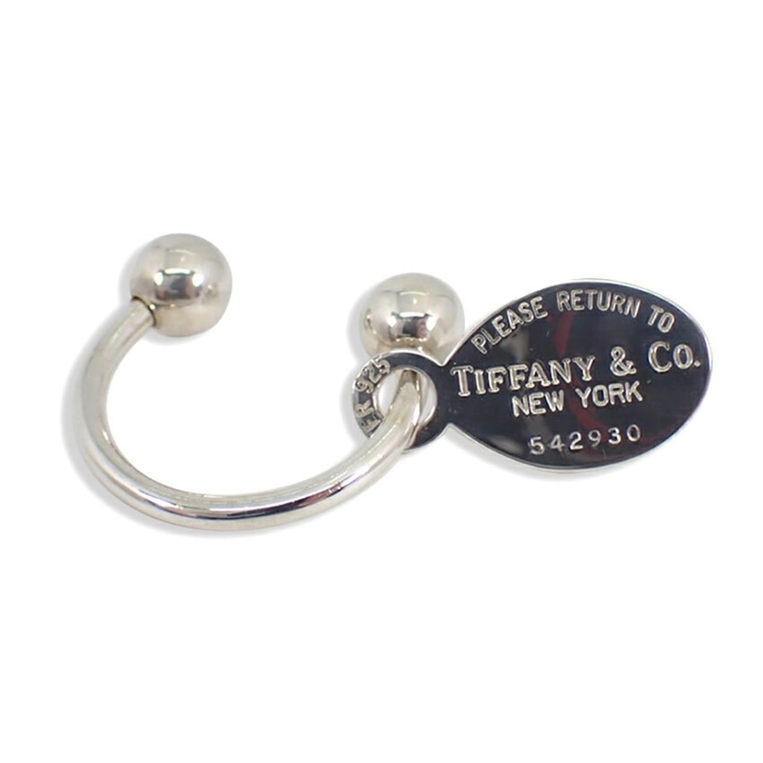 TIFFANY & Co. 925 Return to Oval Tag Keyring: --- Catalog ---Category: DesignType: KeyringGender: WomenMaterial: Sterling silver 925Category: GeneralBrand: Tiffany--- Item List ---Section: ConditionRanking: Rank A Used - A few traces of usage, so