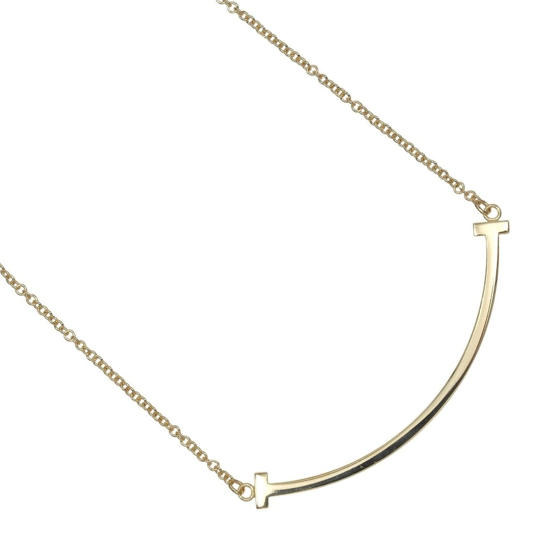 Tiffany & Co. T Smile Small Necklace, 18K Yellow Gold, Approx. 3g: --- Catalog ---Category: SizeWeight: 3g / 0.1oz.Pendant Size: 9.5mm x 37.5mm / 0.37'' x 1.47''Neck Circumference: 44 cm / 17.32''Category: DesignGender: WomenMaterial: Yellow gold (18K)Necklace Type: 