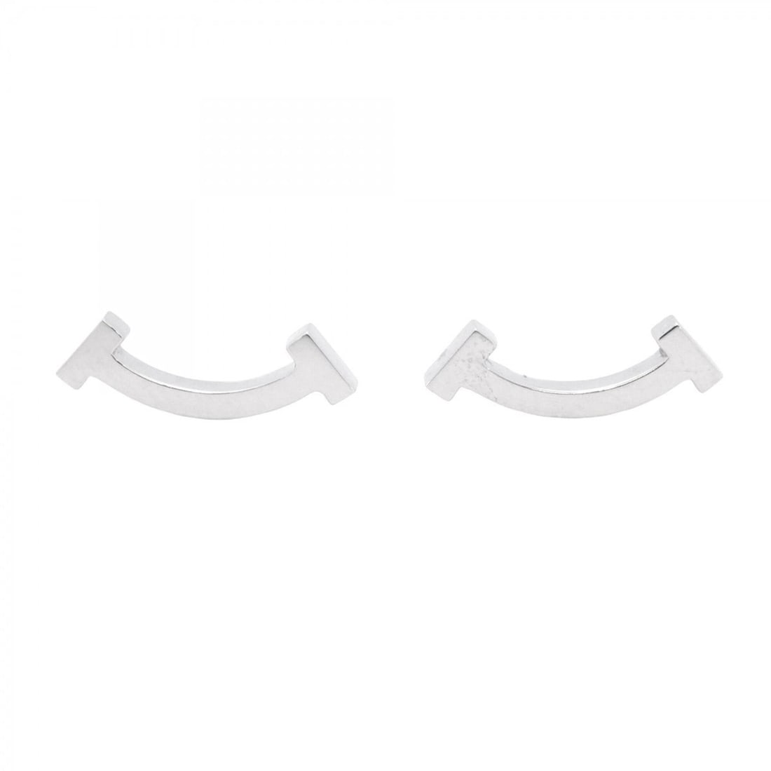 Tiffany & Co. T Smile Mini Earrings, 18K White Gold, Women's: --- Catalog ---Category: SizeSize (HxWxD): 4.70mm x 13.40mm / 0.19'' x 0.53''Category: DesignType: Stud earringsGender: WomenMaterial: White gold (18K)Category: GeneralBrand: Tiffany--- Item List ---S